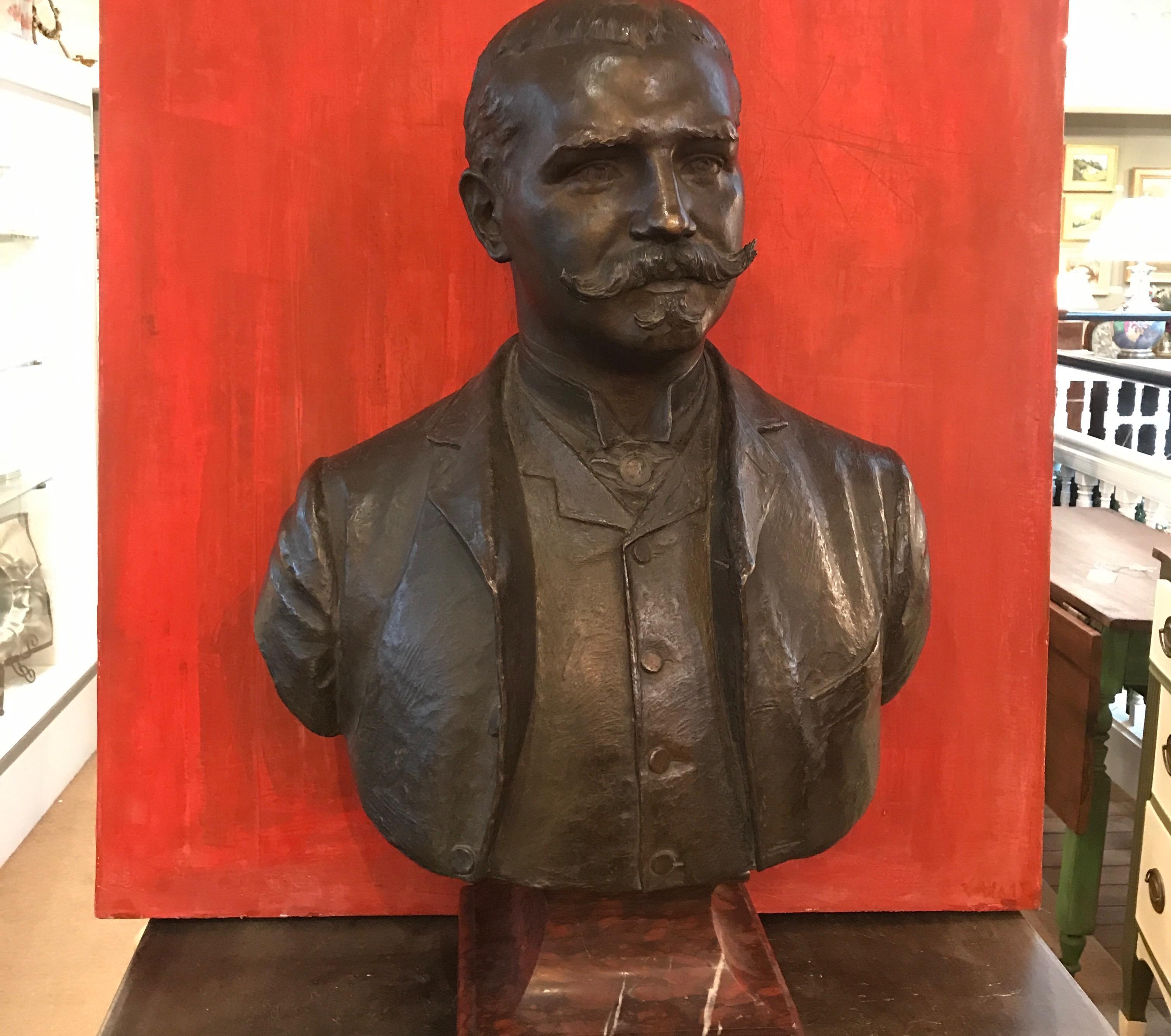 A large bronze bust with rouge marble plinth base. Elegant late 19th century gentleman, made in Italy circa 1880 in excellent original condition. This piece is signed by the artist on the shoulder is cursive style, illegible signature.