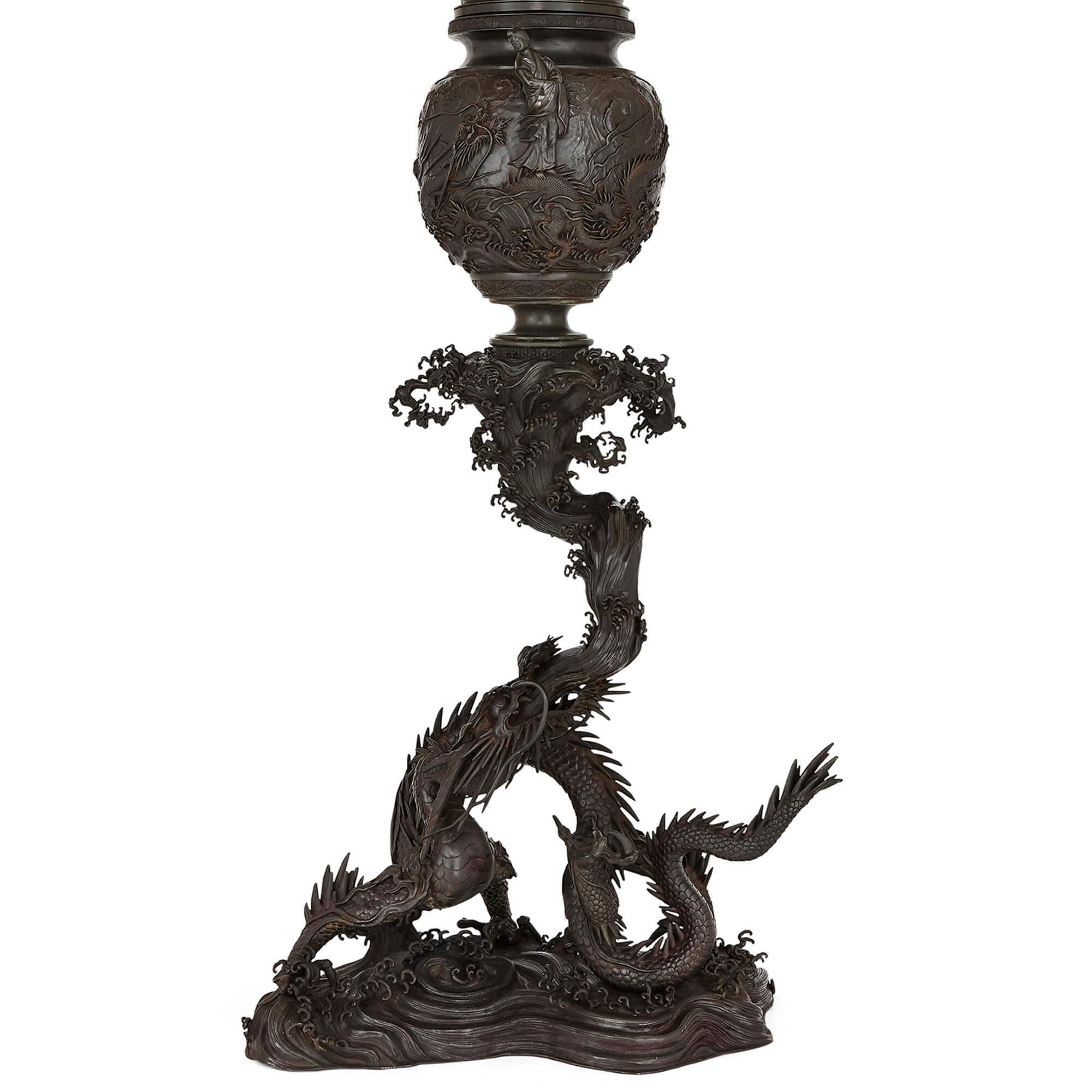Large patinated bronze Japanese koro incense burner
Japanese, late 19th Century
Dimensions: Height 221cm, width 97cm, depth 57cm

This monumental koro is modelled from patinated bronze as an ovoid bowl surmounted with a tiered and pierced lid