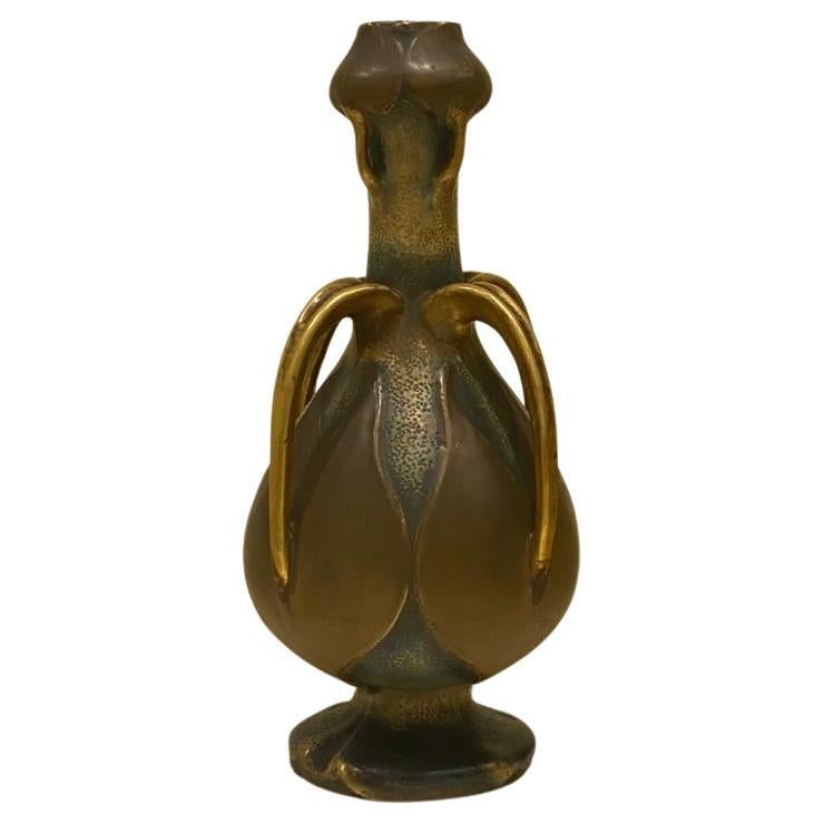 A Large Riessner, Stellmacher & Kessel large Amphora vase decorated with water lilies; attributed to Paul Dachsel, Turn-Teplitz, Bohemia; c. 1903; neck of vase with stems of leaves forming four small gilt handles; four large gilt stem handles on