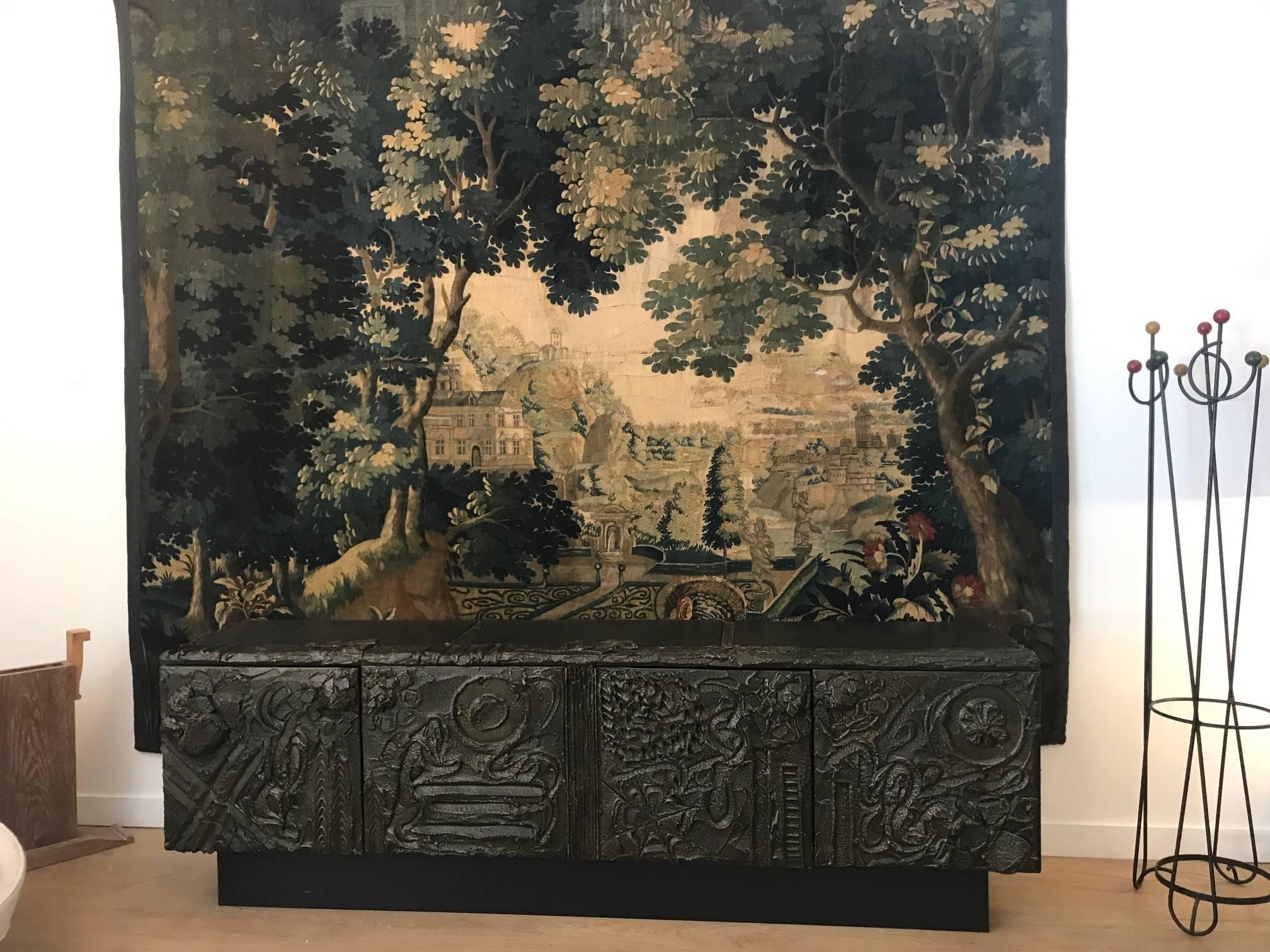 Large and impressive hand-sculpted and patinated resin bronze cabinet by Paul Evans Studio for Directional, signed and dated PE73. 
Two double doors concealing adjustable shelves to each side. Three inset slate tops.
 