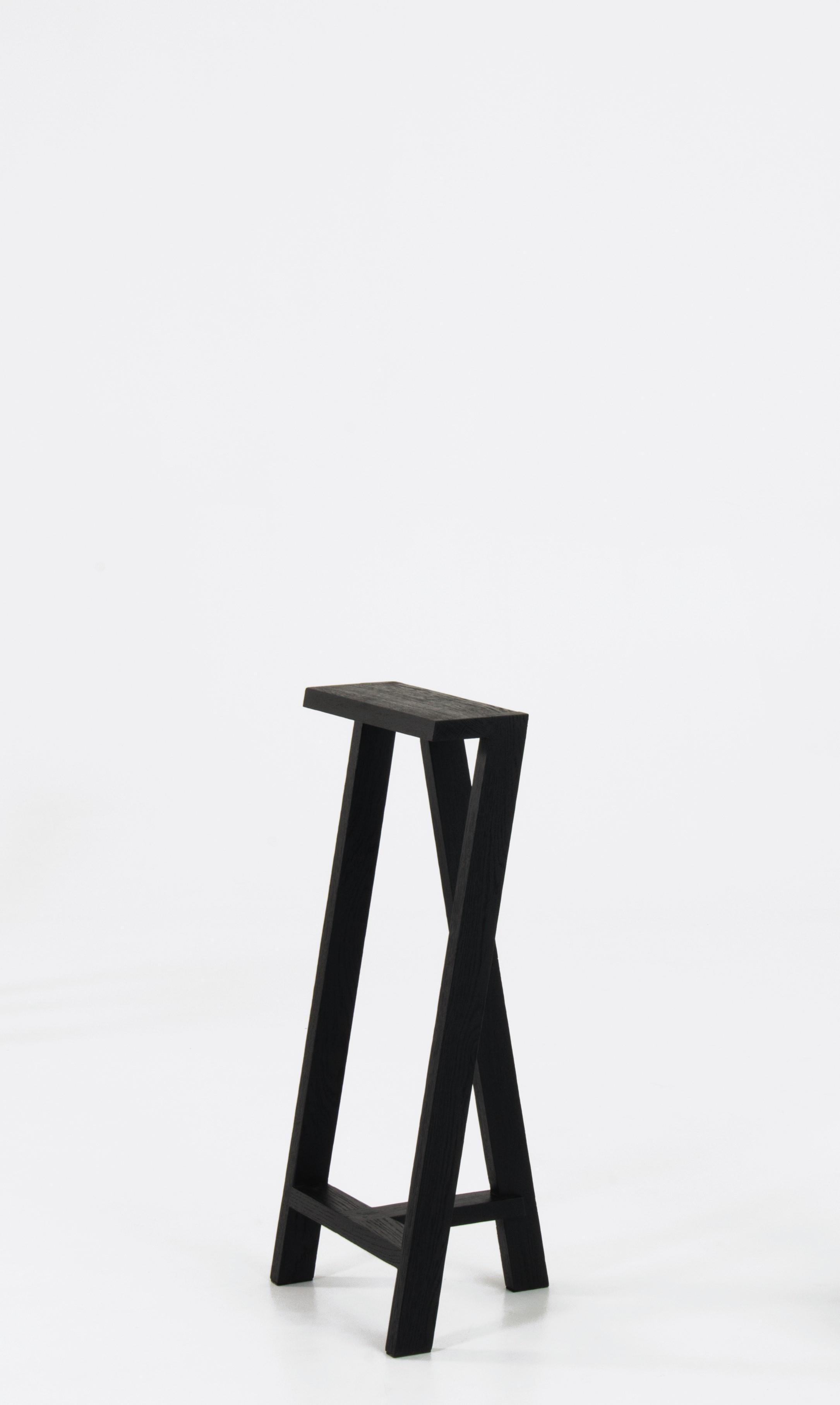 Large Pausa oak stool by Pierre-Emmanuel Vandeputte
Dimensions: D 35 x W 35 x H 75 cm.
Materials: Burned Oak.
Available in natural oak version and in 3 sizes.

Pausa is a series of stools; 45cm, 65cm, or 75cm of assembled oak pieces. 
The