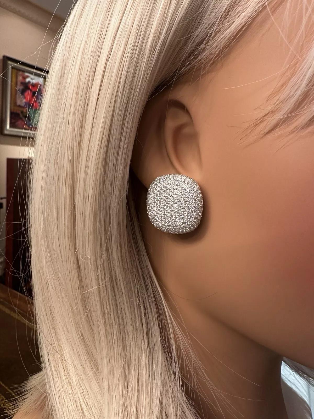 Large Cushion Shaped Pave Diamond Button Earrings in 18k White Gold 

Cushion Shaped Pave Diamond Earrings feature Natural Round Brilliant Diamonds set in 18k White Gold. The earrings are secured by posts with 18k butterfly backs.

Total diamond
