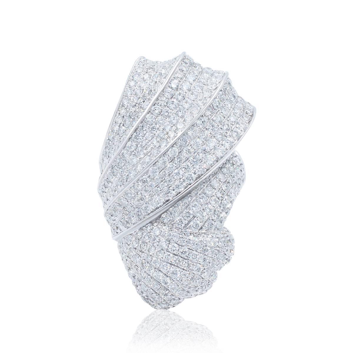 Now this is what we call a ring!

Large piece of jewelry encrusted with pave set round brilliant cuts. 
Diamonds: 4cts
Quality: G-H, VS-SI
Ring grams: 30gr

This is an impressive heavy ring that feels important on. Comfortable to wear and is perfect