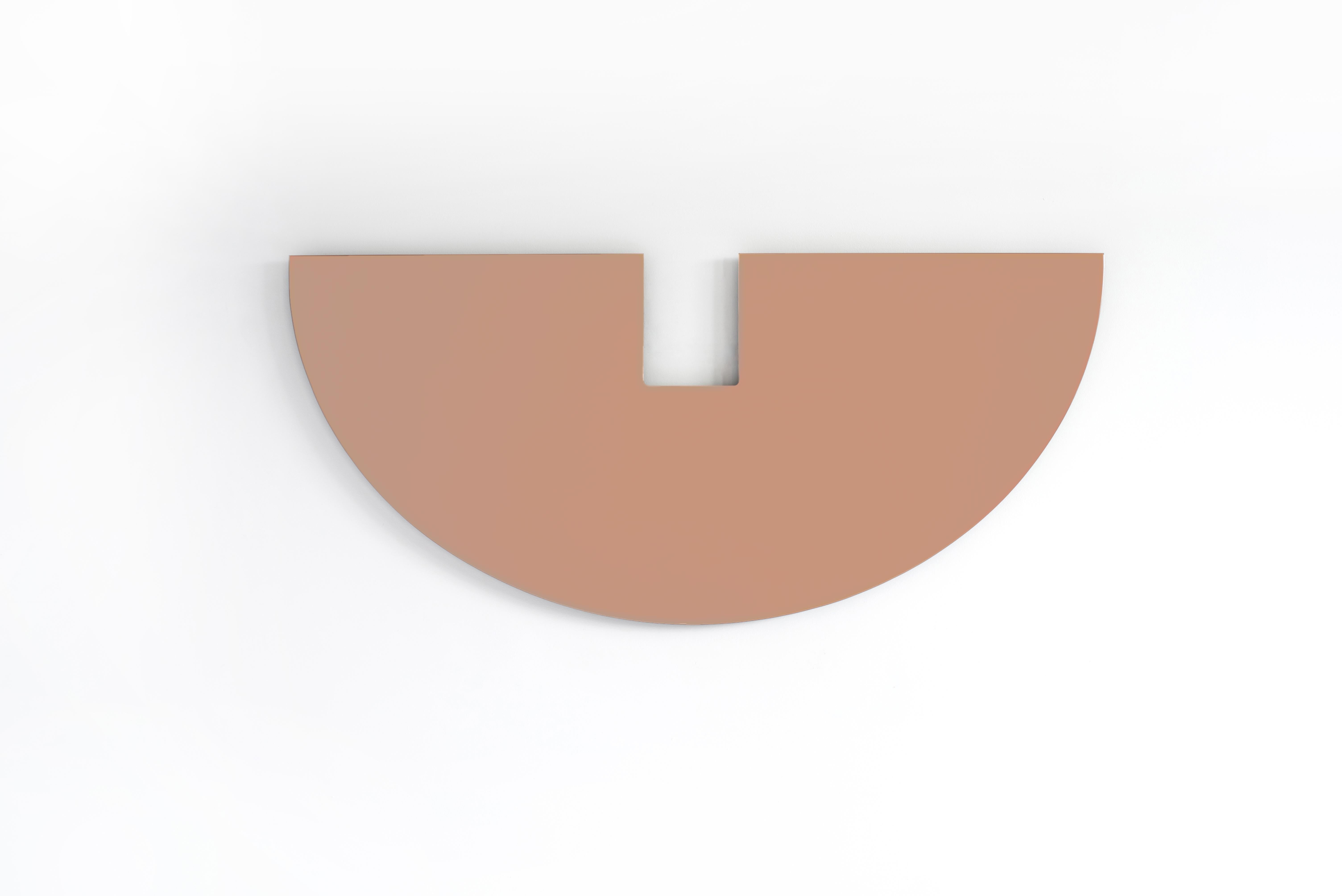 A large scale inverted half moon is interrupted by the absence of mirror, creating a balance of positive and negative space. Made to order with customization in mirror finish and sizing is available. Shown here in peach mirror.
 
Additional Mirror