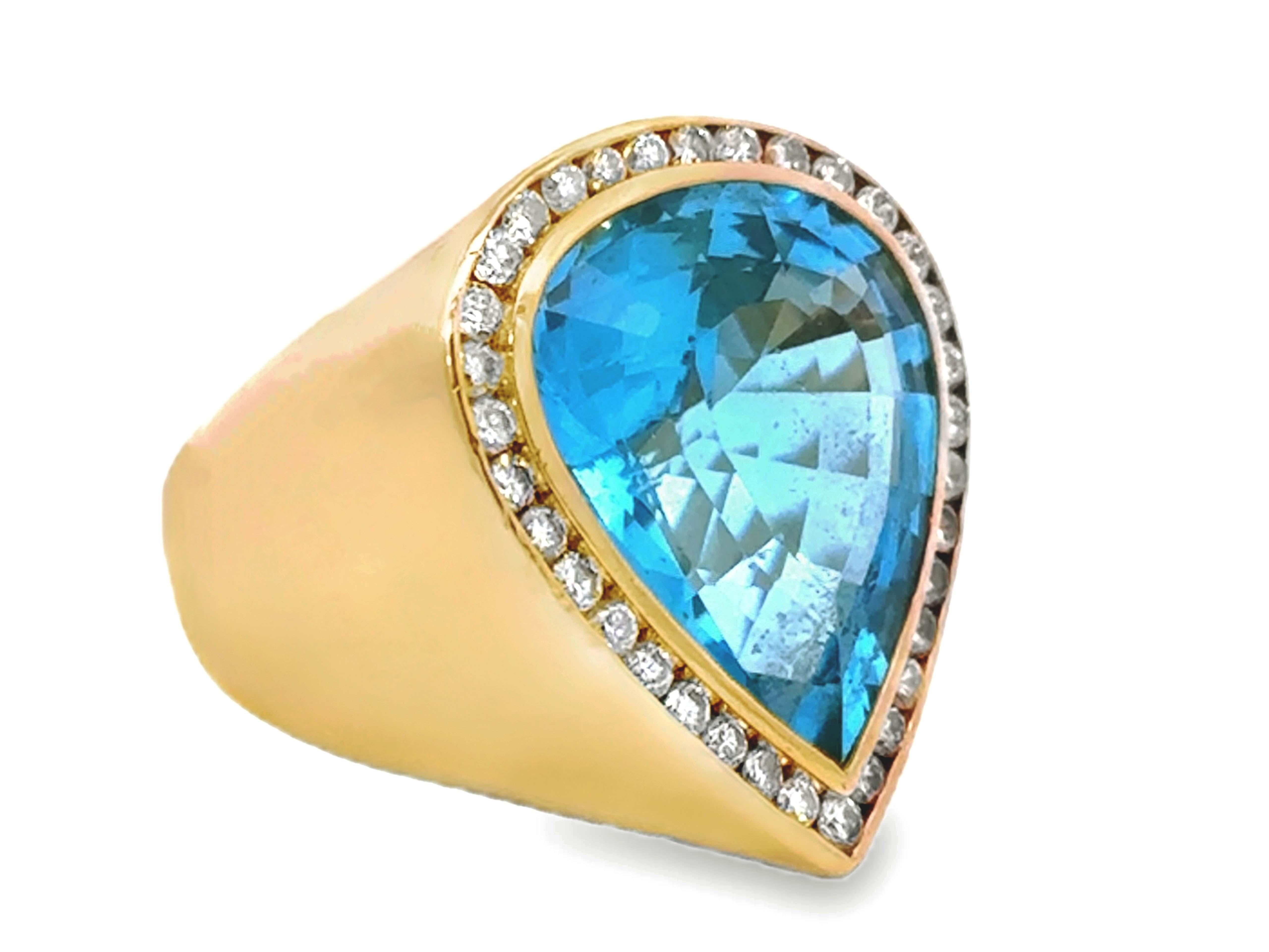 Taglio a goccia Grande anello a forma di pera con topazio blu e diamanti in oro giallo 18 carati in vendita