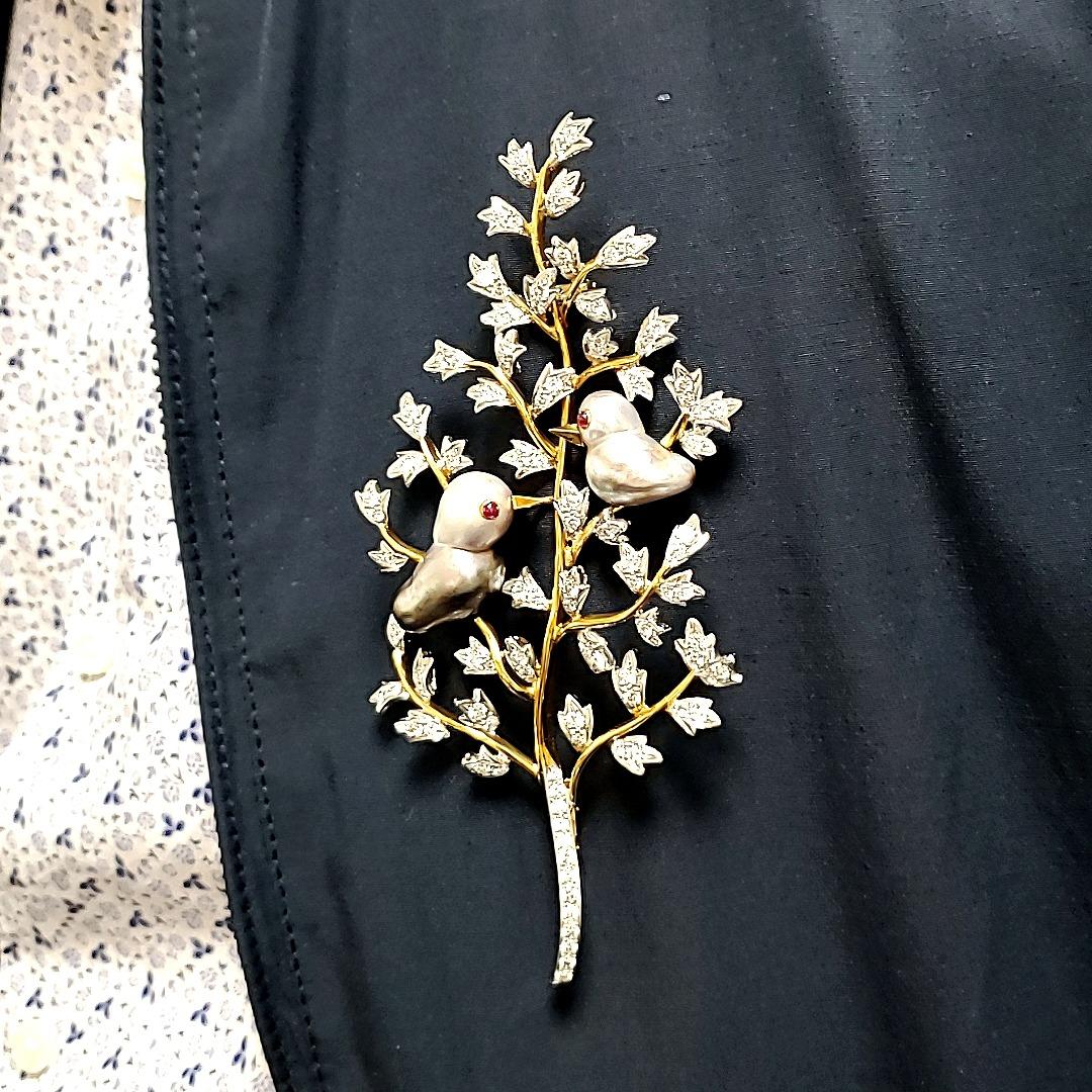 Large Pearl and Diamond Pin 18K

A very large and showy pin measuring 12 cm in length and 6 cm wide. Extremely attractive and eye catching, this exclusive pin took 12 months to manufacture as every branch and twirl had to be given perfection and