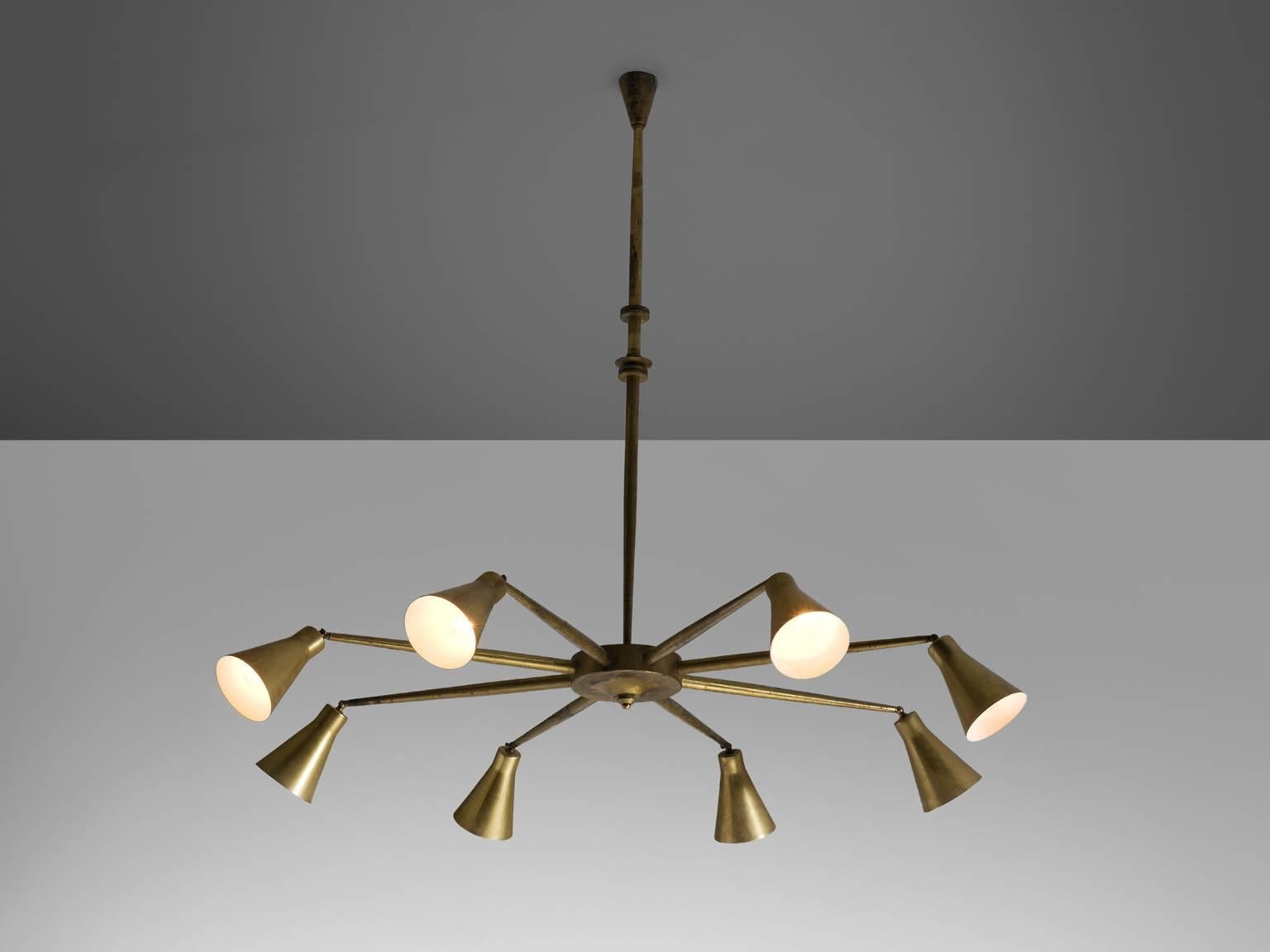 Pendant attributed to Giuseppe Ostuni, brass, Italy, circa 1958.

This brass, large eight-armed pendant is attributed to Giuseppe Ostuni for O-Luce. The lamp is both modern and Classic at the same time. A trait that Italian lights often achieve. The