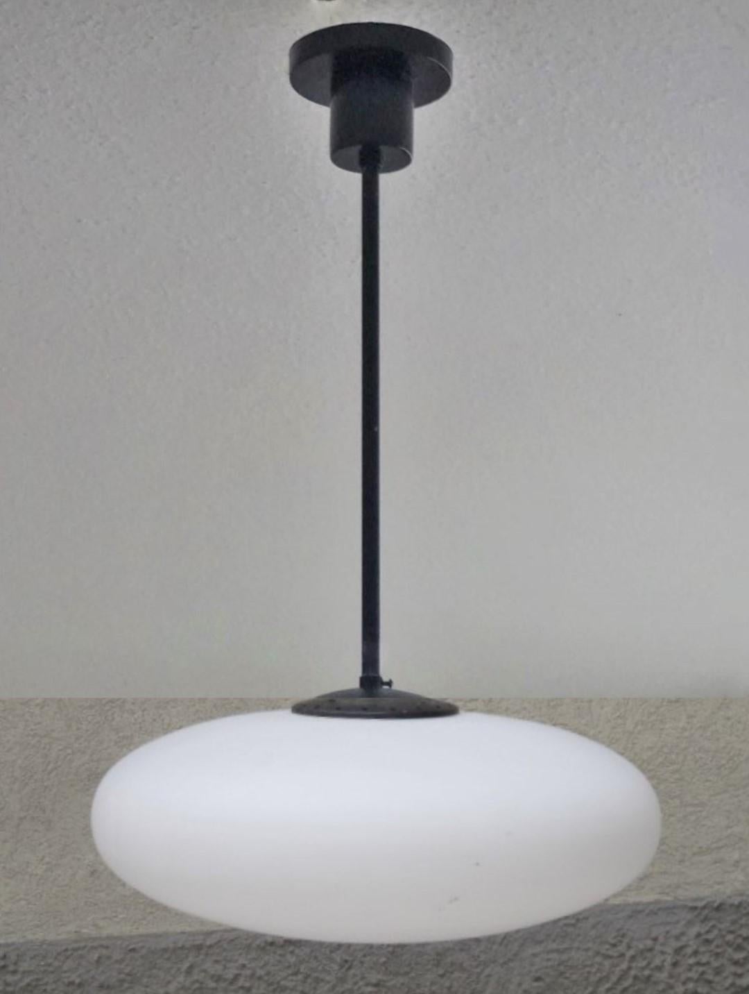 Pendant by Arredoluce manufactured in Italy, 1950s. With large brushed satin glass diffuser, black enameled steel mounts. It takes one E27 100w bulb. Rewired and ready to hang.
Measures: Diameter 23