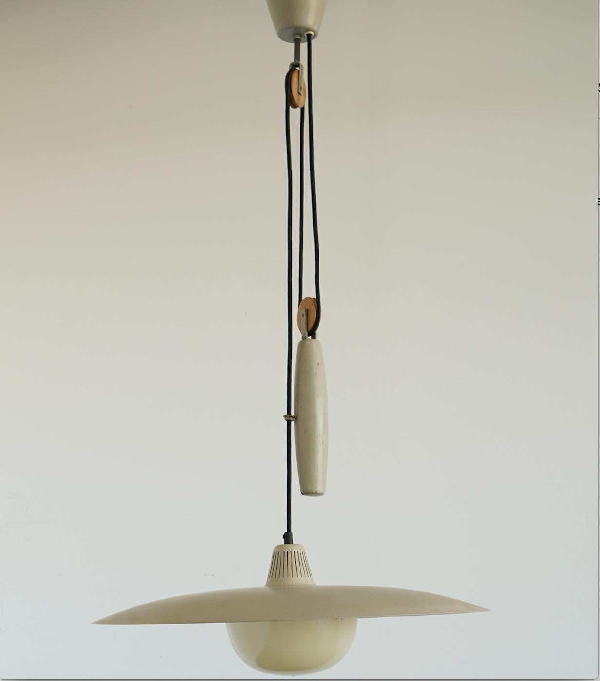 Large metal lighting pendant by Bergboms Sweden. Model T-6H. Circa 1950th.
Original painted finish and plastic defuser. Stamped with manufacturer name and model number. Some scratches and stains on surface.
Newly rewired, ready for installation.