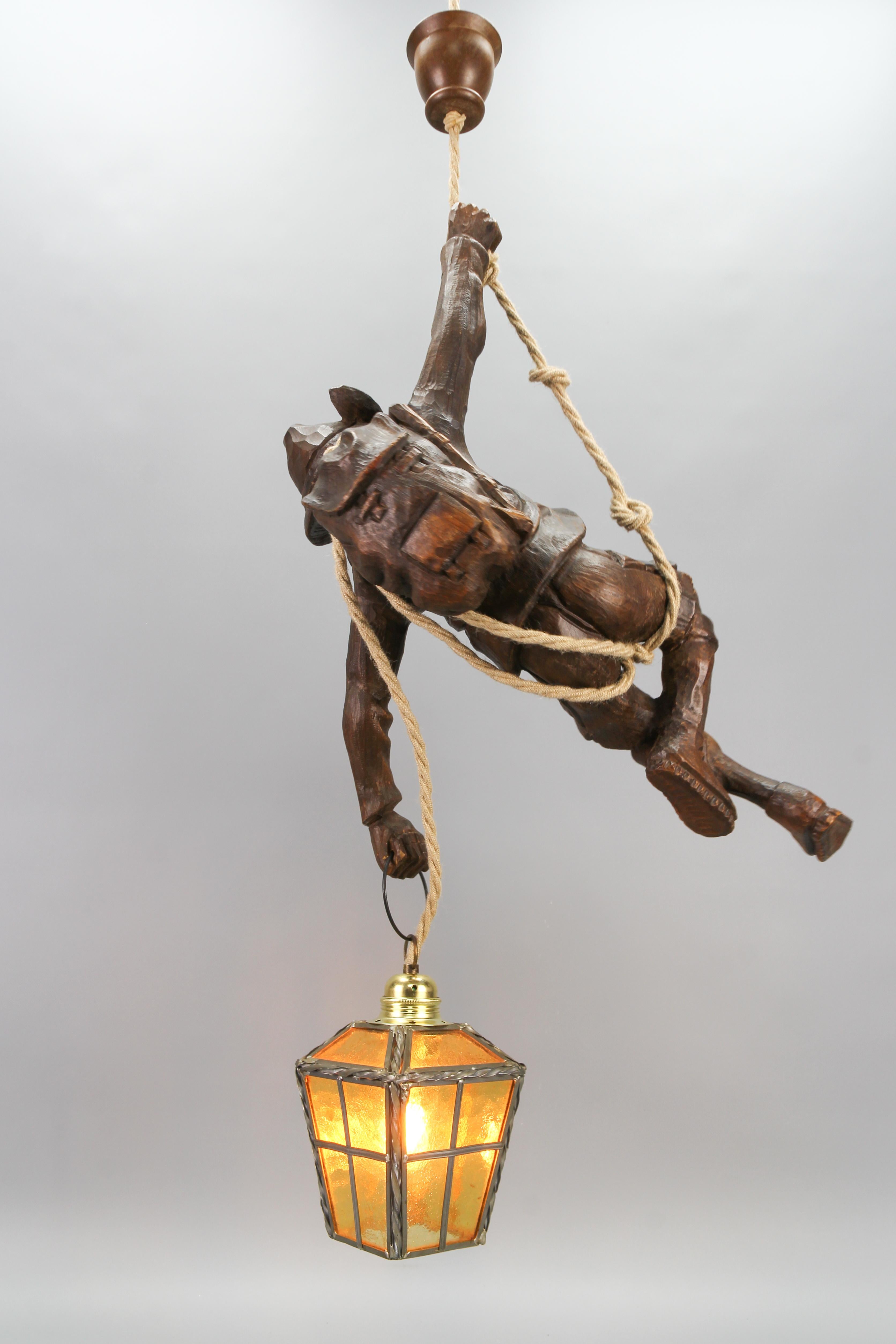 Hand-Carved Large Pendant Light Fixture with Carved Climber Figure and Lantern, Germany For Sale