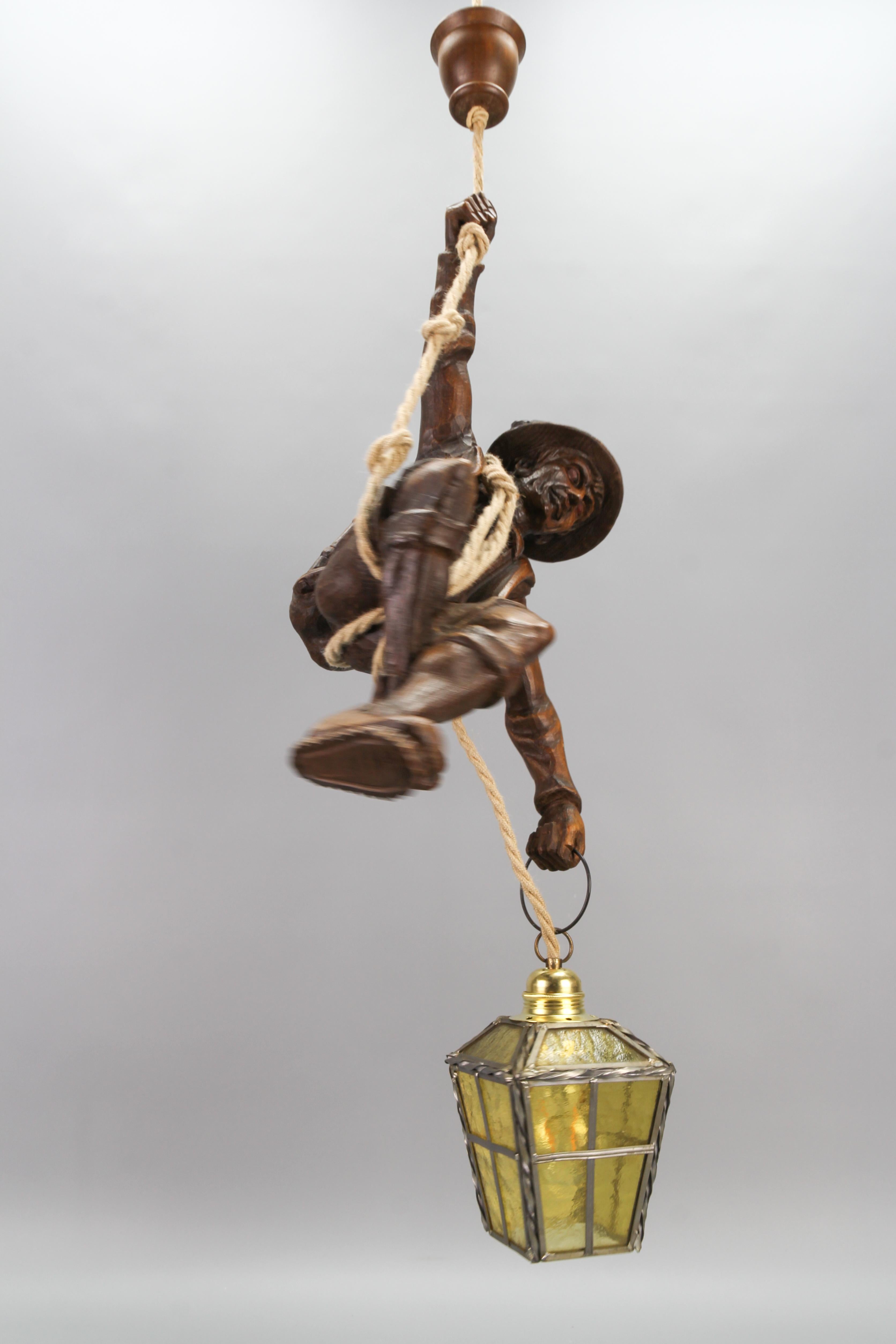 Wood Large Pendant Light Fixture with Carved Climber Figure and Lantern, Germany For Sale
