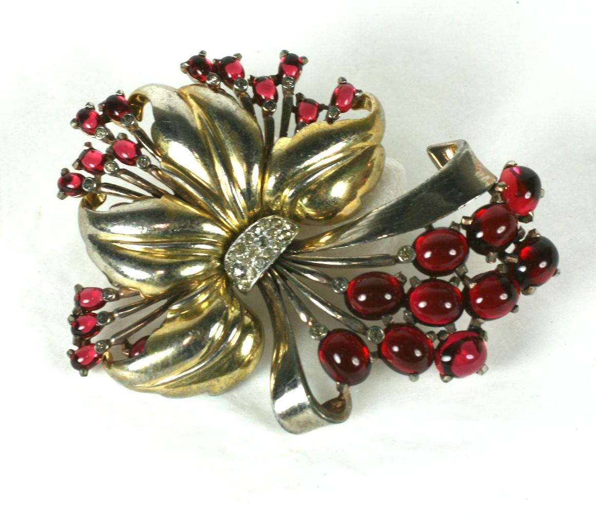 Large Pennino Retro Ruby Spray from the late 1930's. High style design, with leaves and sprays of faux cab rubies. 3