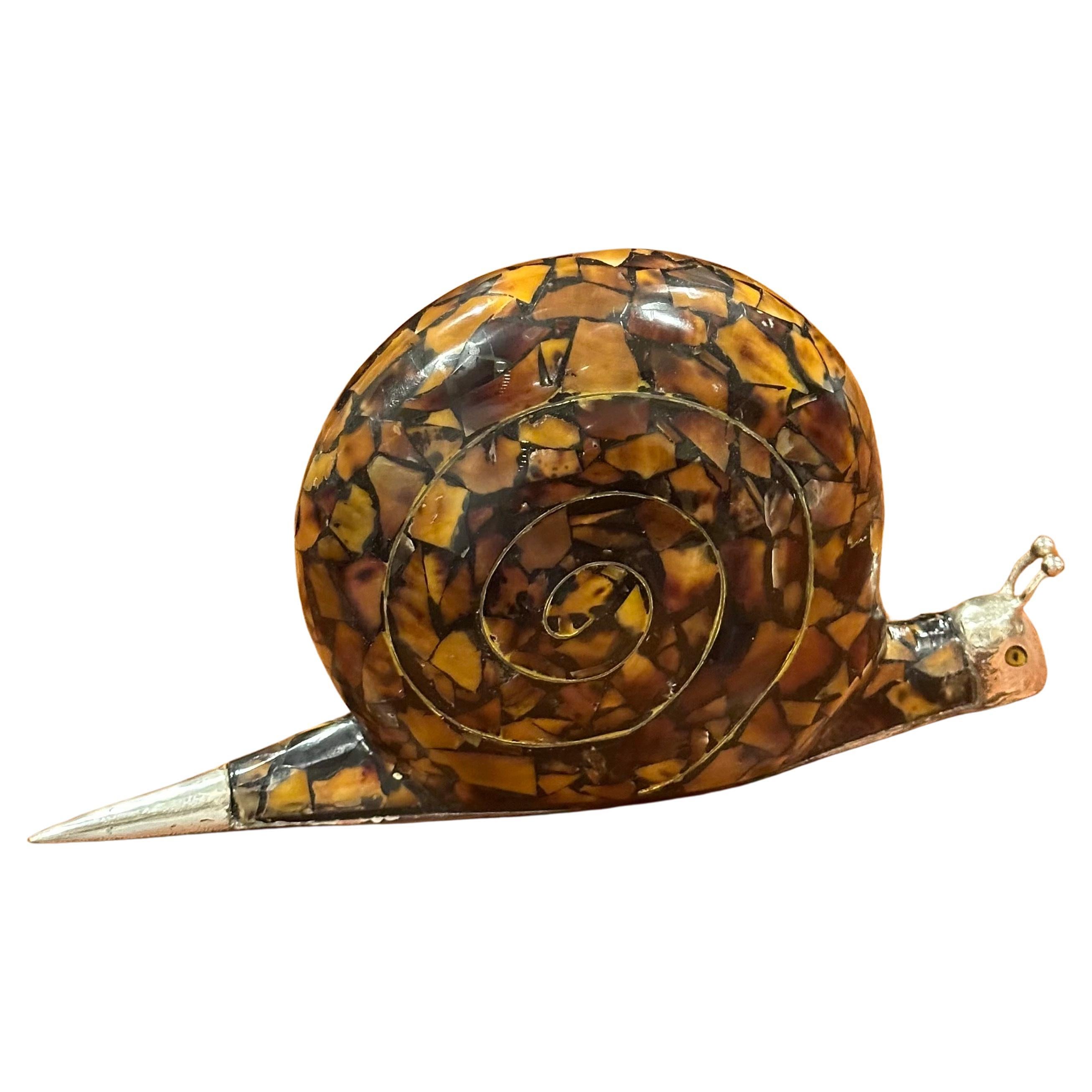 Large penshell and silver plate snail sculpture by Maitland Smith, circa 1970s. This hard to find piece is in very good vintage condition and measures 9.75
