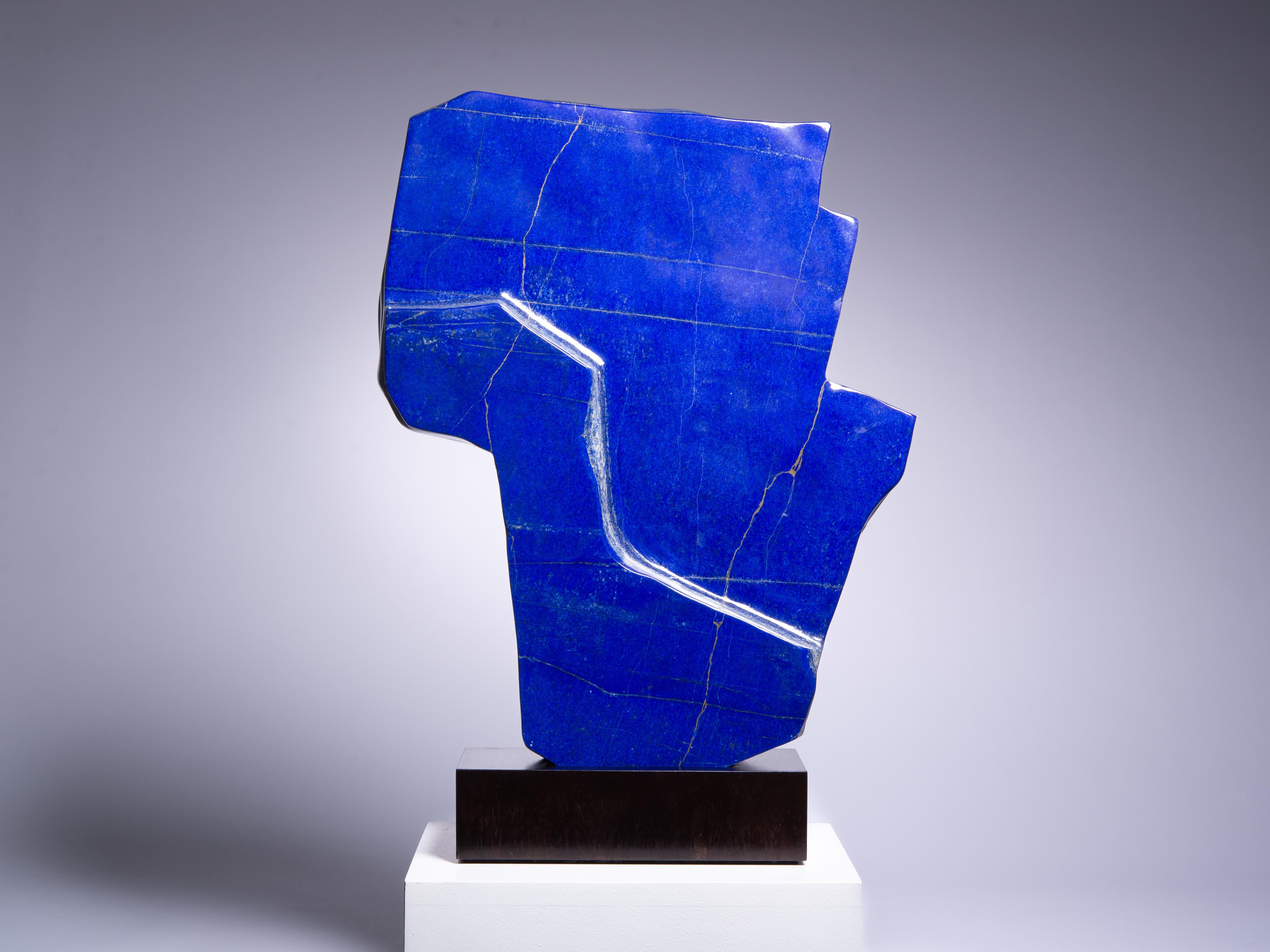 An almost perfect section of intense lapis lazuli. Most lapis sections have
multiple white calcite veins within the rock, whereas the present piece is
an extraordinarily pure block with a high proportion of lazurite. A truly exceptional