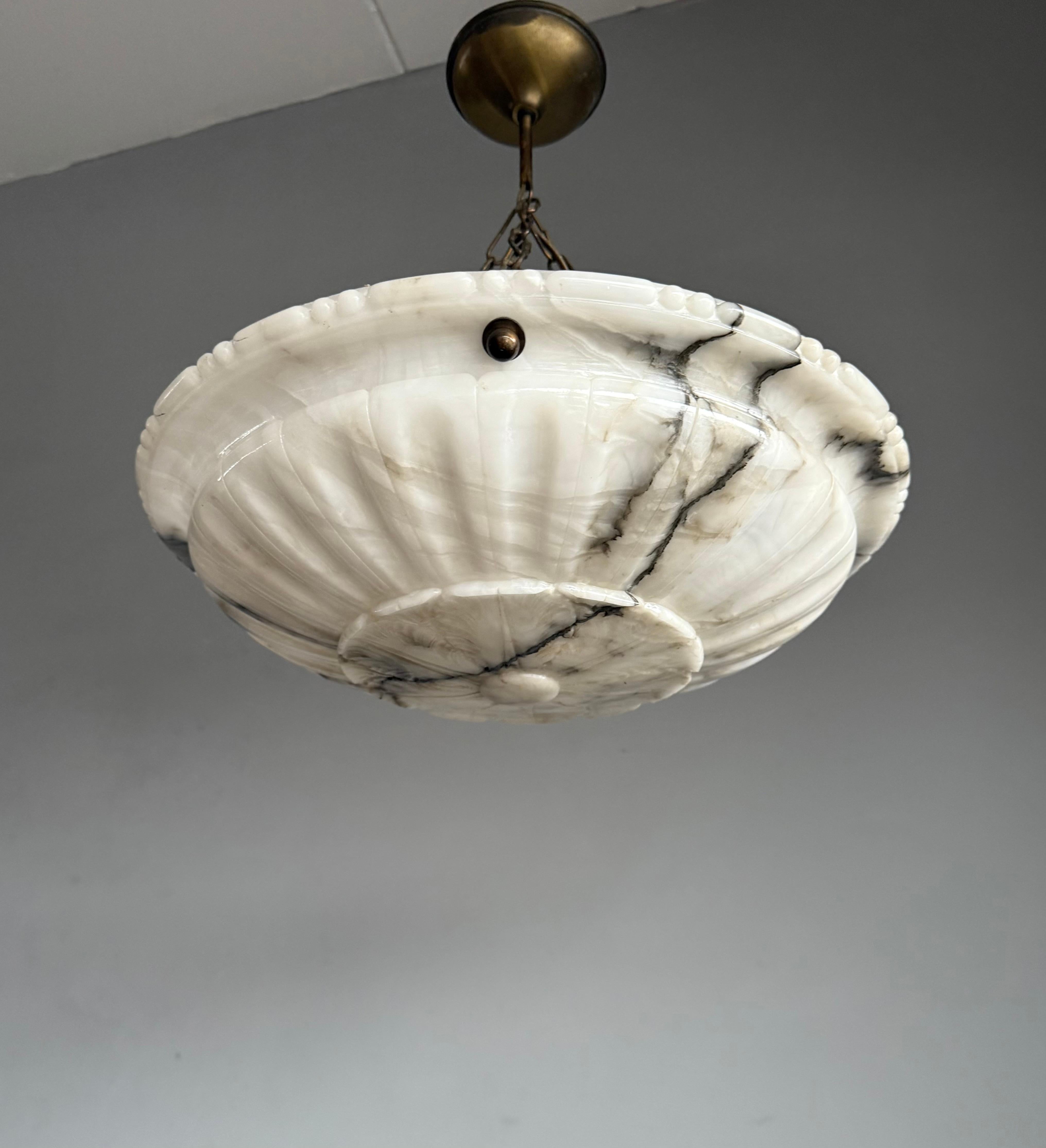 Stunning and large size, 18 inches in diameter alabaster 3-light fixture.

Thanks to its large size and timeless design this alabaster chandelier from the Arts and Crafts era is one of the most beautiful models we have seen and sold to date. We have