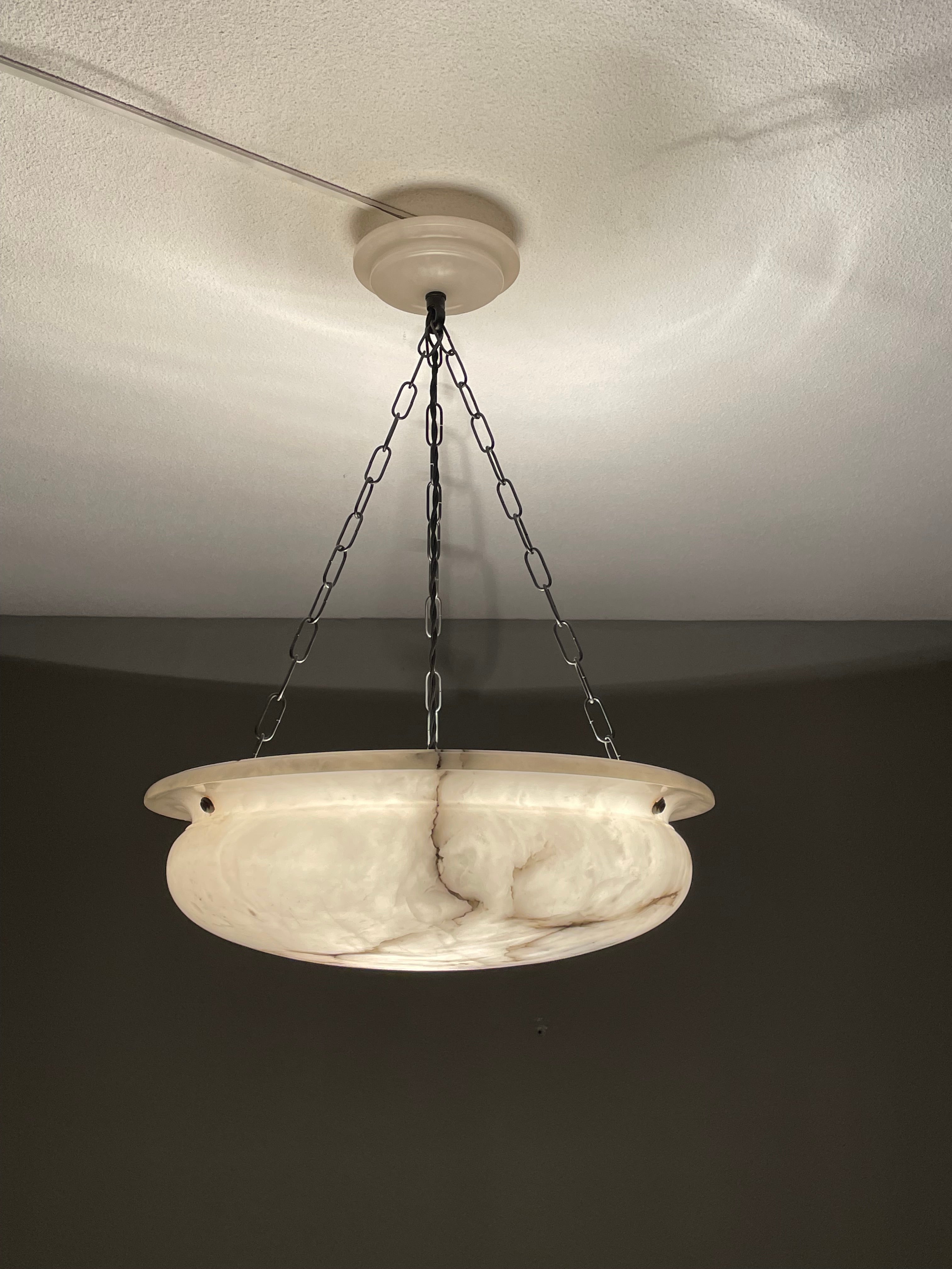 Stunning and the ideal size 17.5 inches in diameter alabaster light fixture.

Thanks to its large size and timeless design this alabaster chandelier from the Arts and Crafts era is one of the most beautiful models we have seen and sold to date. We