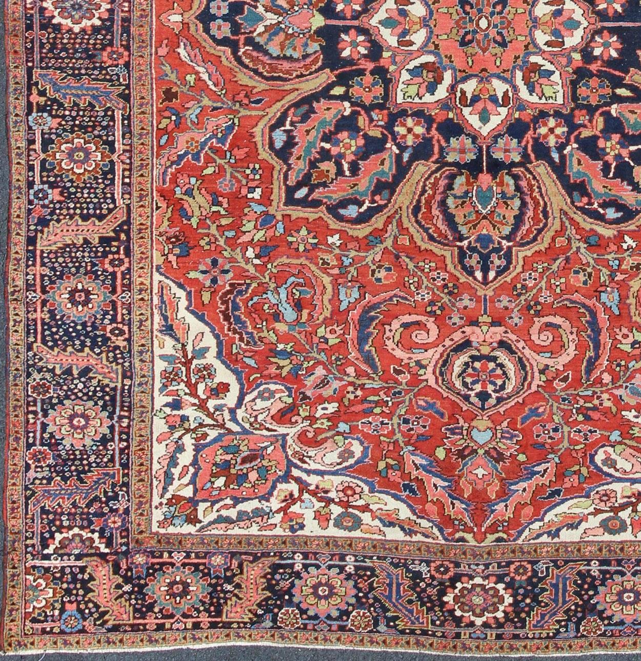 Large Persian Heriz Rug with Geometric Medallion in Rust, Pink, Green and Blue.  Keivan Woven Arts / Rug / M14-0501, country of origin / type: Iran /Heriz, circa 1930. 
Measures: 10'1 x 13'5.
Masterful craftsmanship and a strong tribal design make