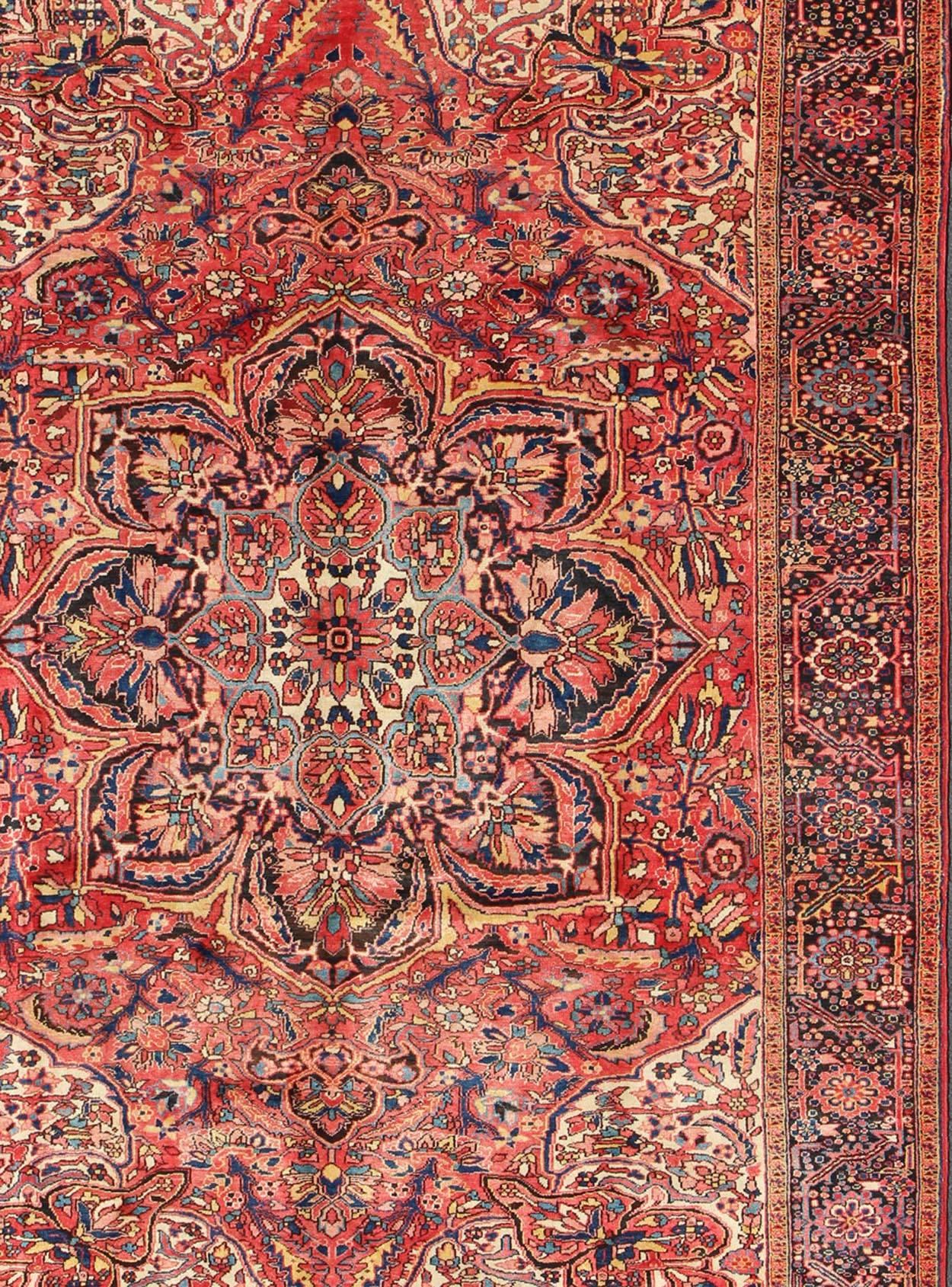 Hand-Knotted Large Persian Semi Antique Heriz with Stylized Medallion Design in Soft Colors For Sale