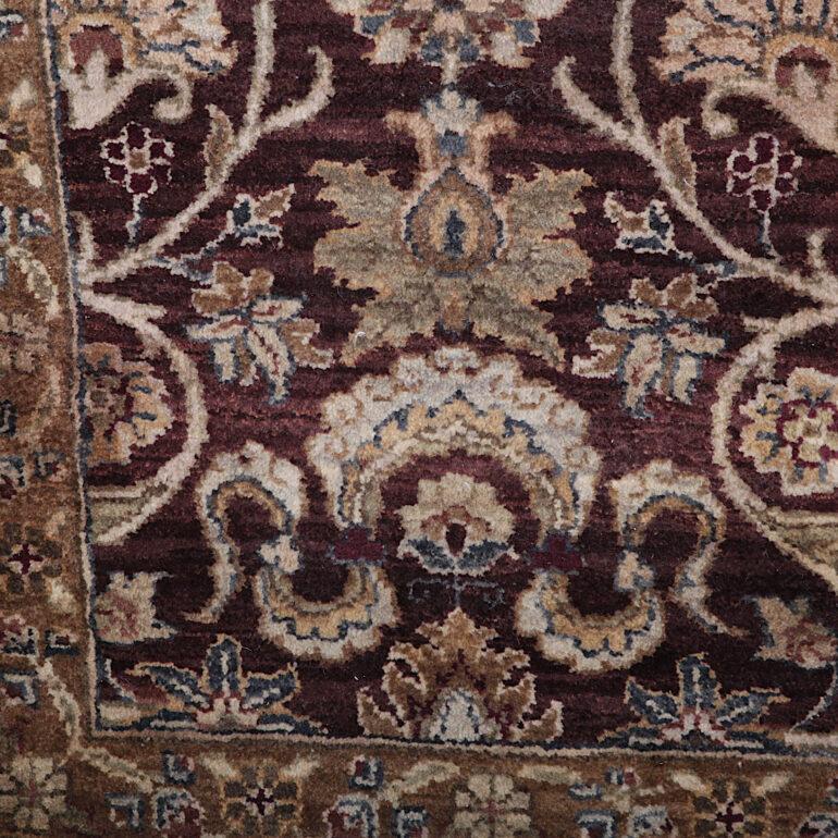 Large Persian silk and wool area carpet. This carpet is think and plush with deep maroon, gold and light sage tones. C.1990.