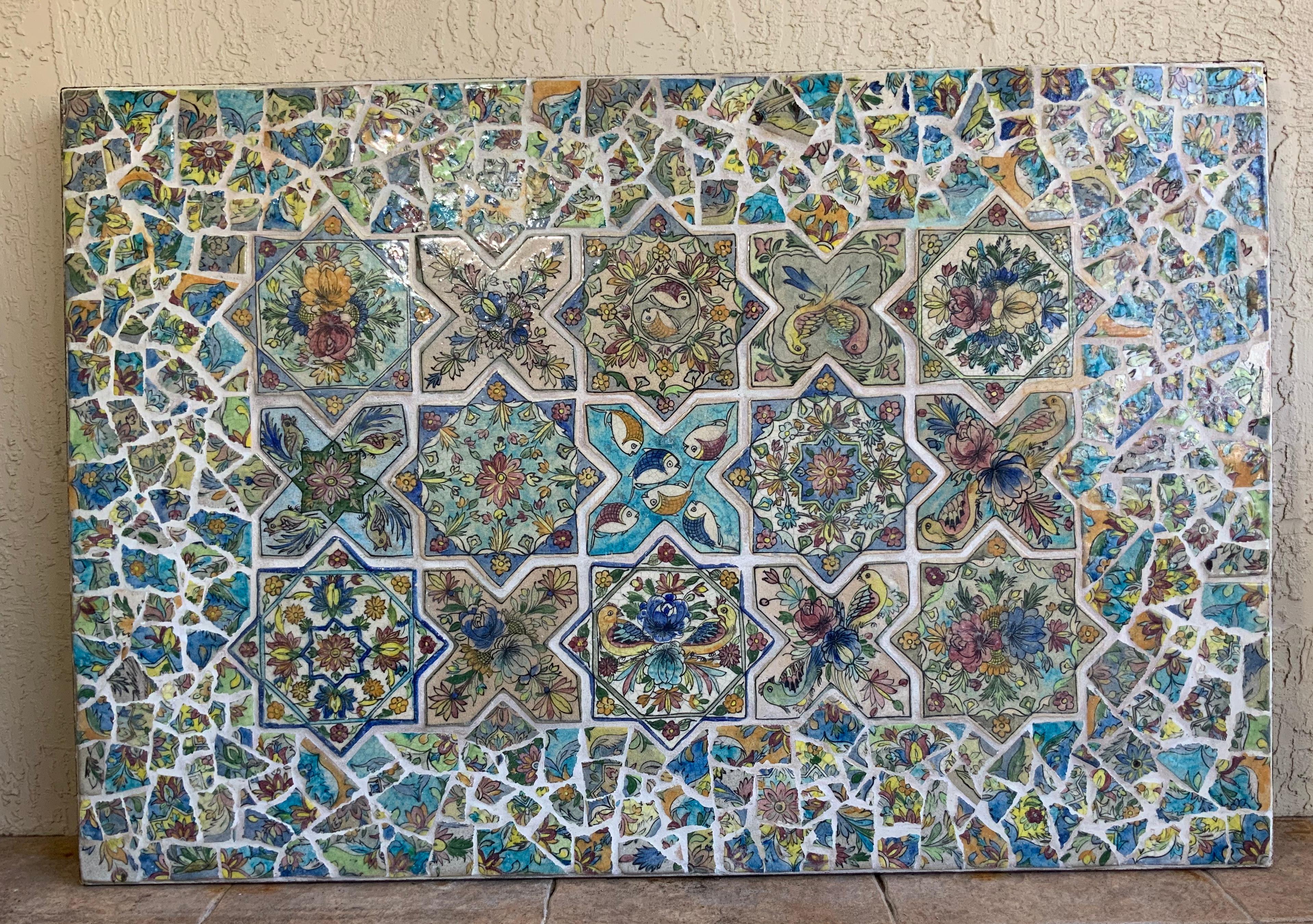 One of a kind wall hanging professionally made of solid steel frame ,imbedded with beautiful antique hand painted Persian ceramic tiles, flowers, vines and birds motifs. Beautiful colors of green, blue, yellow, and fantastic turquoise , surrounded