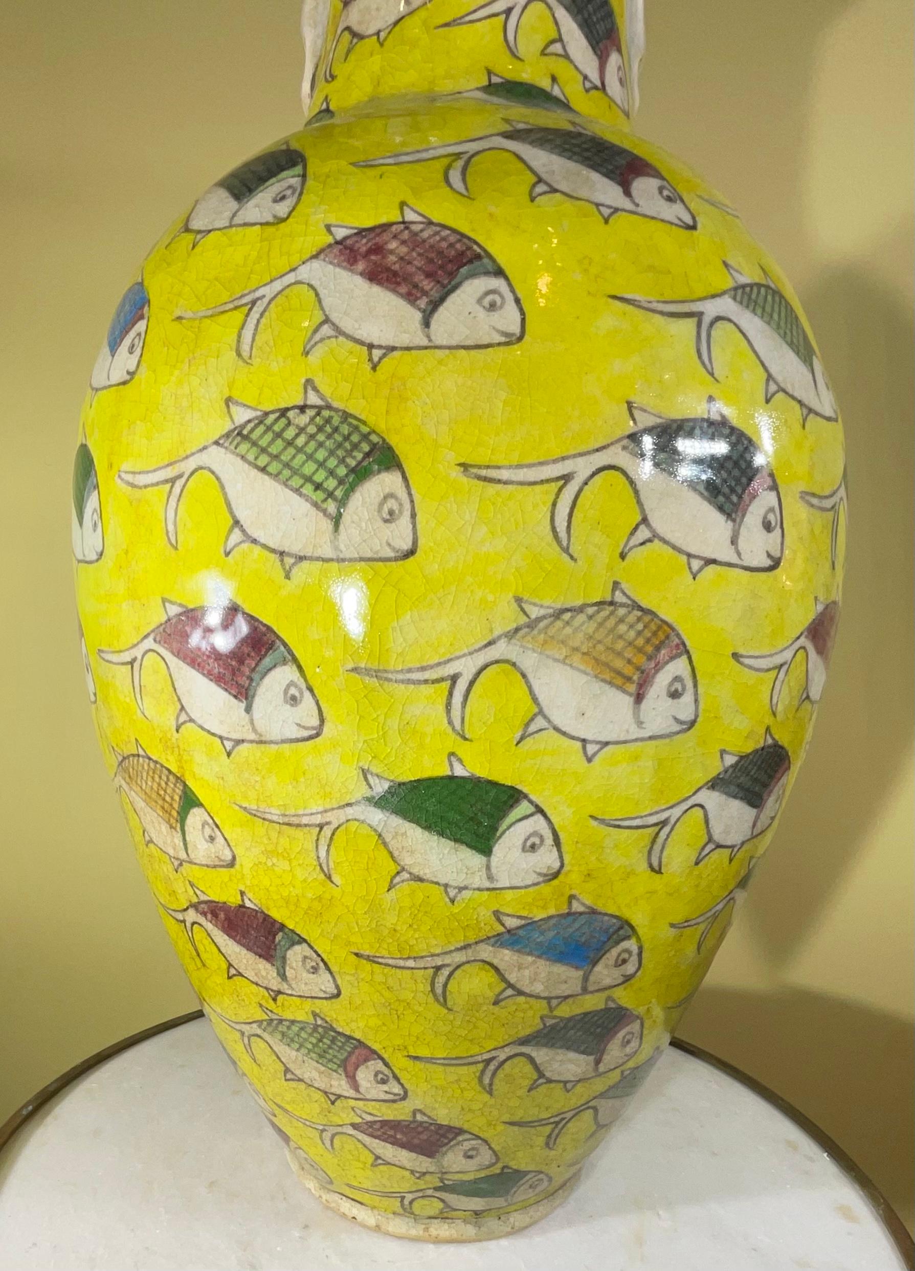 Beautiful Persian ceramic vase hand-painted and glazed with colourful fish motif surrounding on yellow color background.
 Great object of art for display.