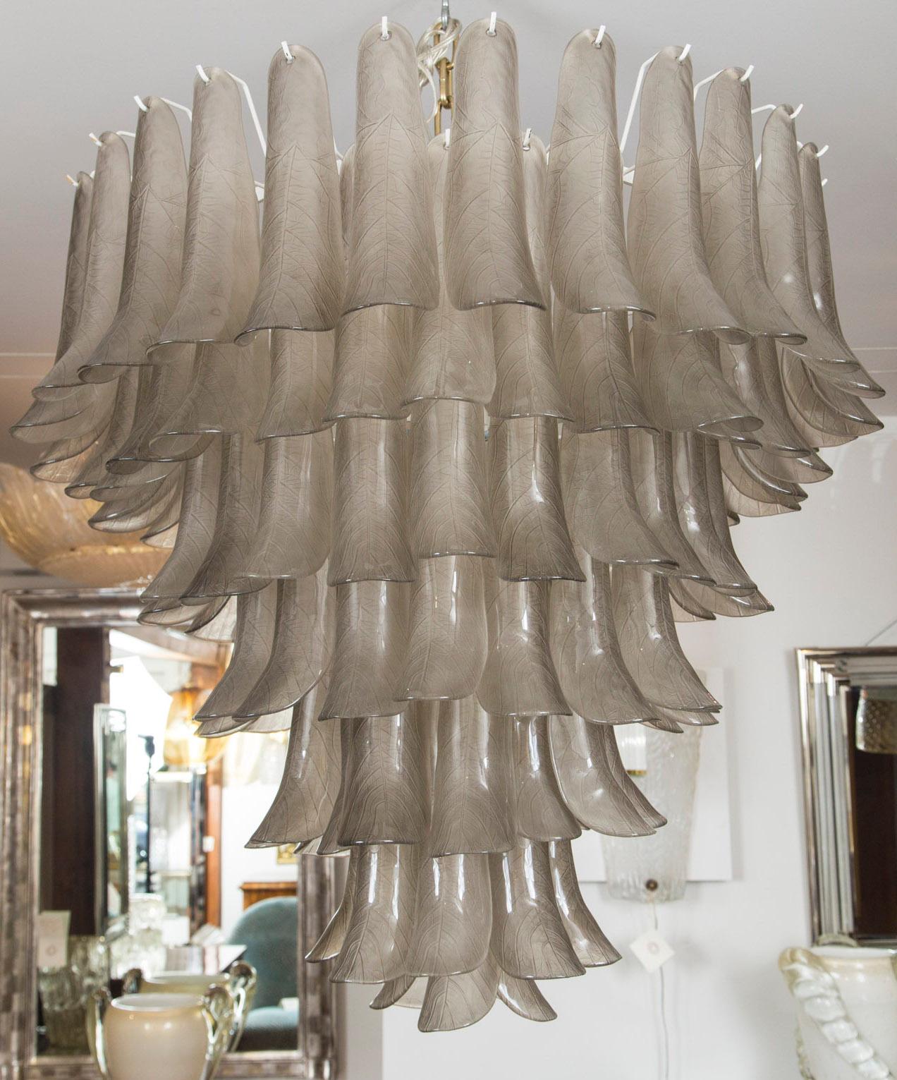 Lovely and large Murano blown ceiling fixture composed of approximately 120 glass blown leaf textured taupe- grey petal forms displayed in seven tiers. 
Install ready to desired drop, electrified to code (additional UL certification)
Note, each
