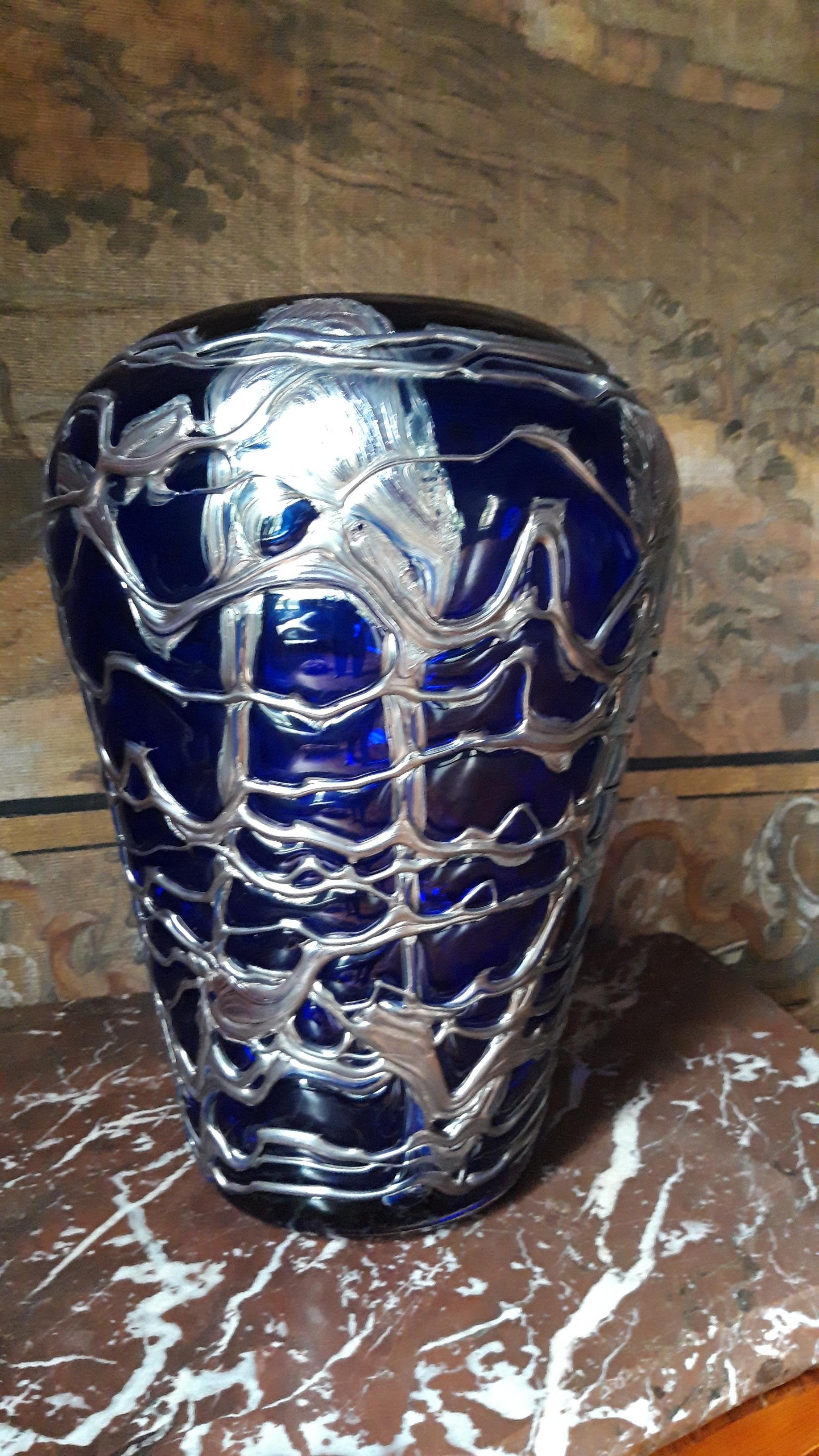 Large pewter mounted blue crystal vase.