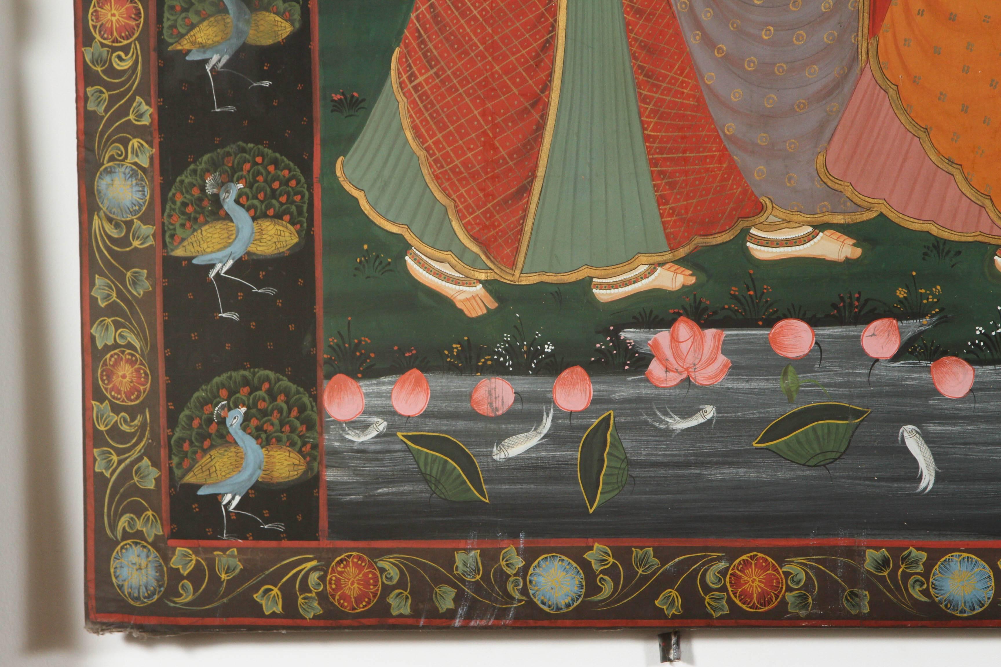 A large Pichhavai painting of Krishna with female Gopis dancing 
Krishna playing flute on a bed of lotus, the composition is enclosed in a lush green forest and the colors of the dresses play off against the vegetative forms, adding a lively pattern