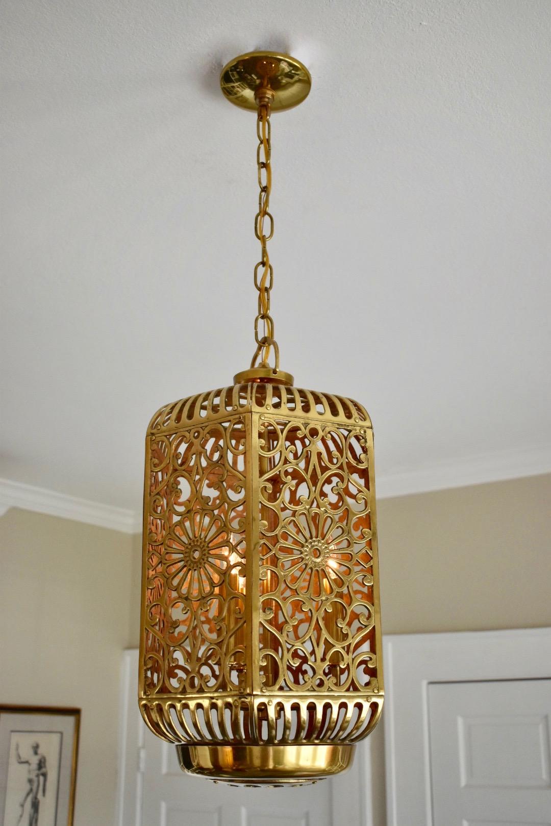 A large and high quality brass ceiling or pendant light with karakusa scrolling arabesque patterns and Imperial chrysanthemum motif. Handcrafted from thick solid brass in Japan in the 1950s, this pendant has been refitted with a custom brass triple