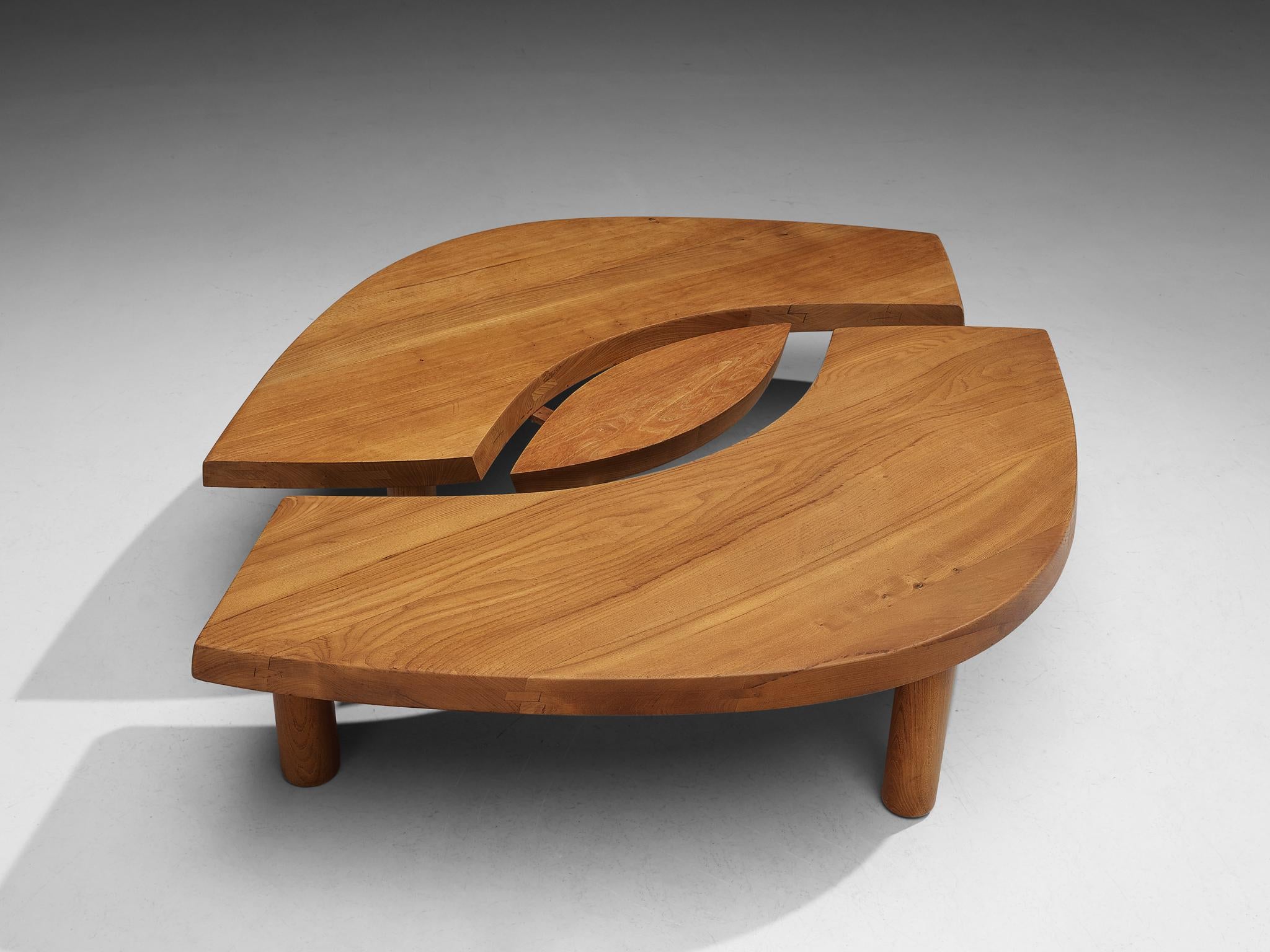 Pierre Chapo, coffee table, model T22C, elm, France, circa 1972

This beautiful eye-shaped cocktail table by the French designer Pierre Chapo (1927-1987) is made out of elm. It consists out of two arch-shaped tables and one oval middle. The table