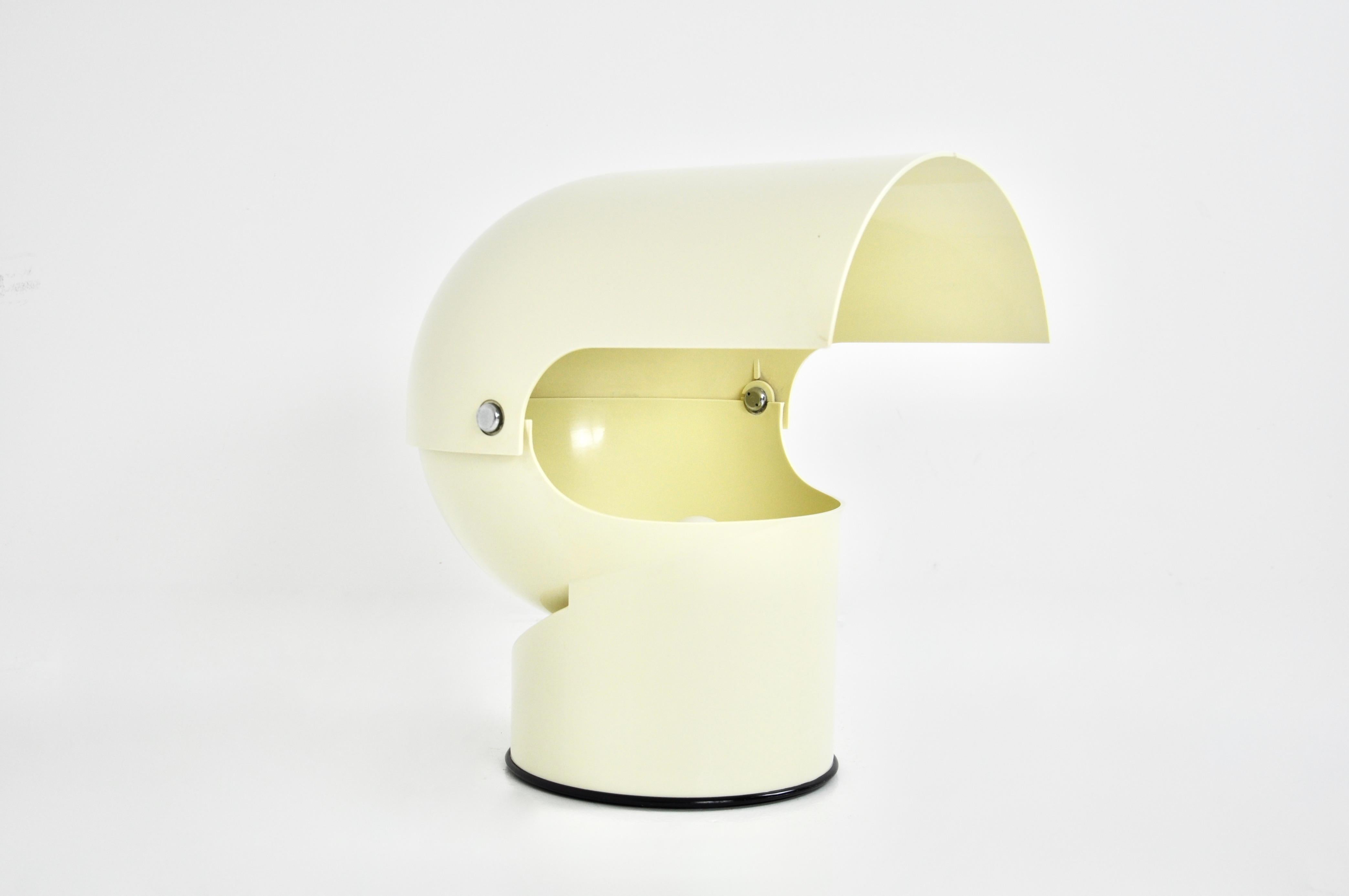 White plastic and metal lamp. Stamped Gae Aulenti , Artemide on the bottom. The adjustable shade. Wear due to time and age.