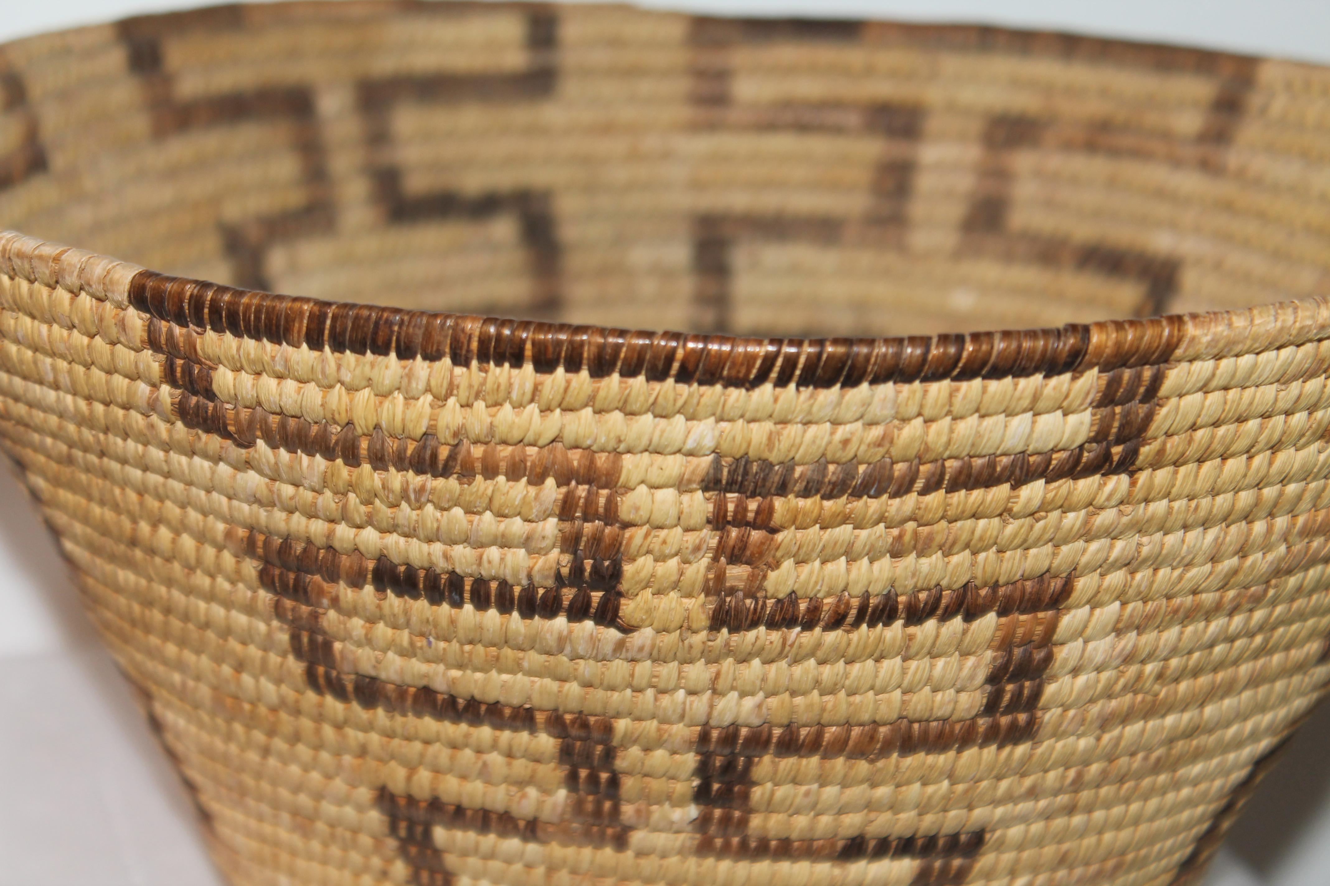 This fine American Indian basket is in fine condition and has a geometric design.
   