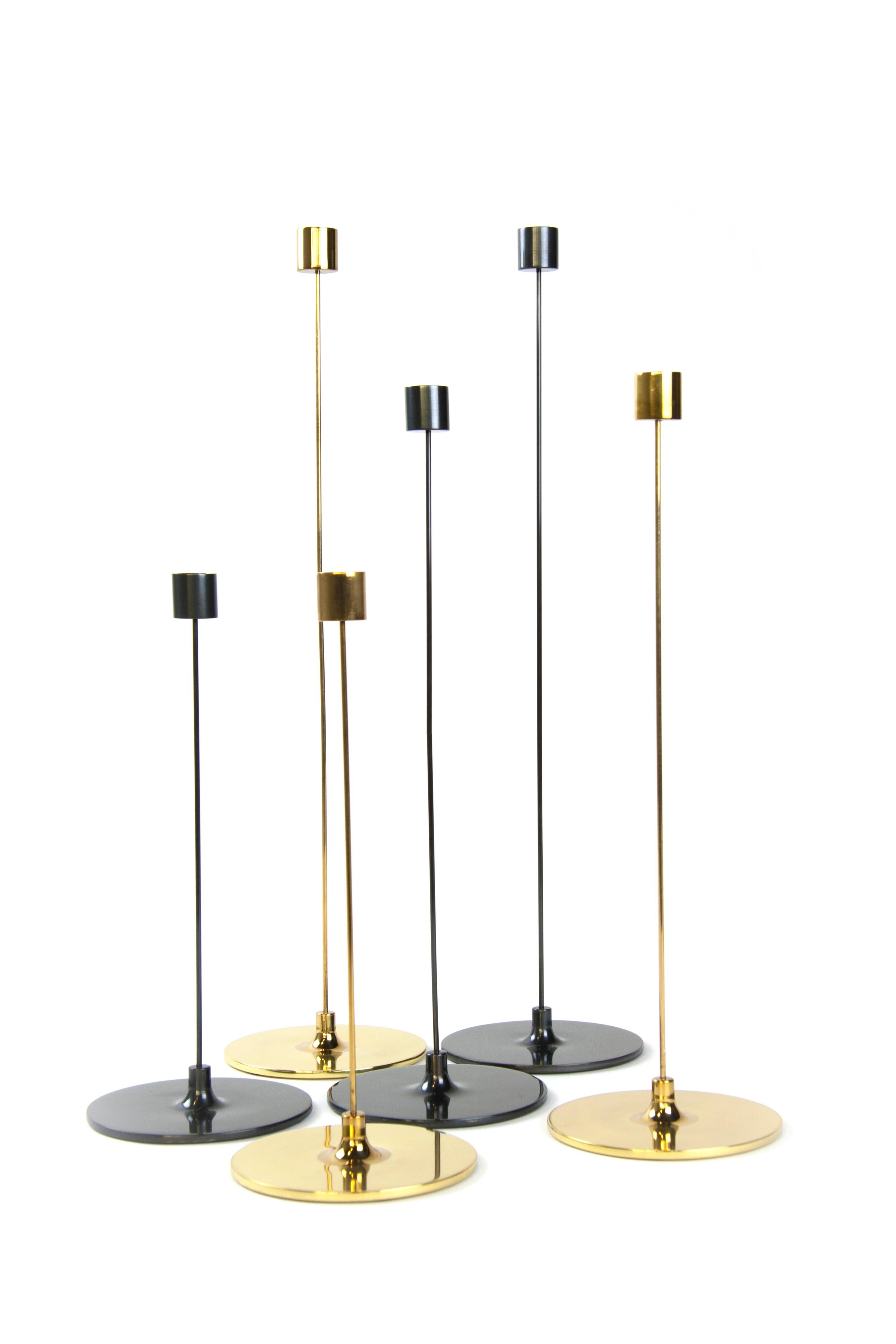 Large Pin darkened brass candlestick by Gentner Design
Dimensions: D 12.7 x H 50.8 cm
Materials: darkened brass
Available in polished tarnished brass and darkened brass.
Available in small, medium and large.

With an 12”, 16”, or 20” height, the