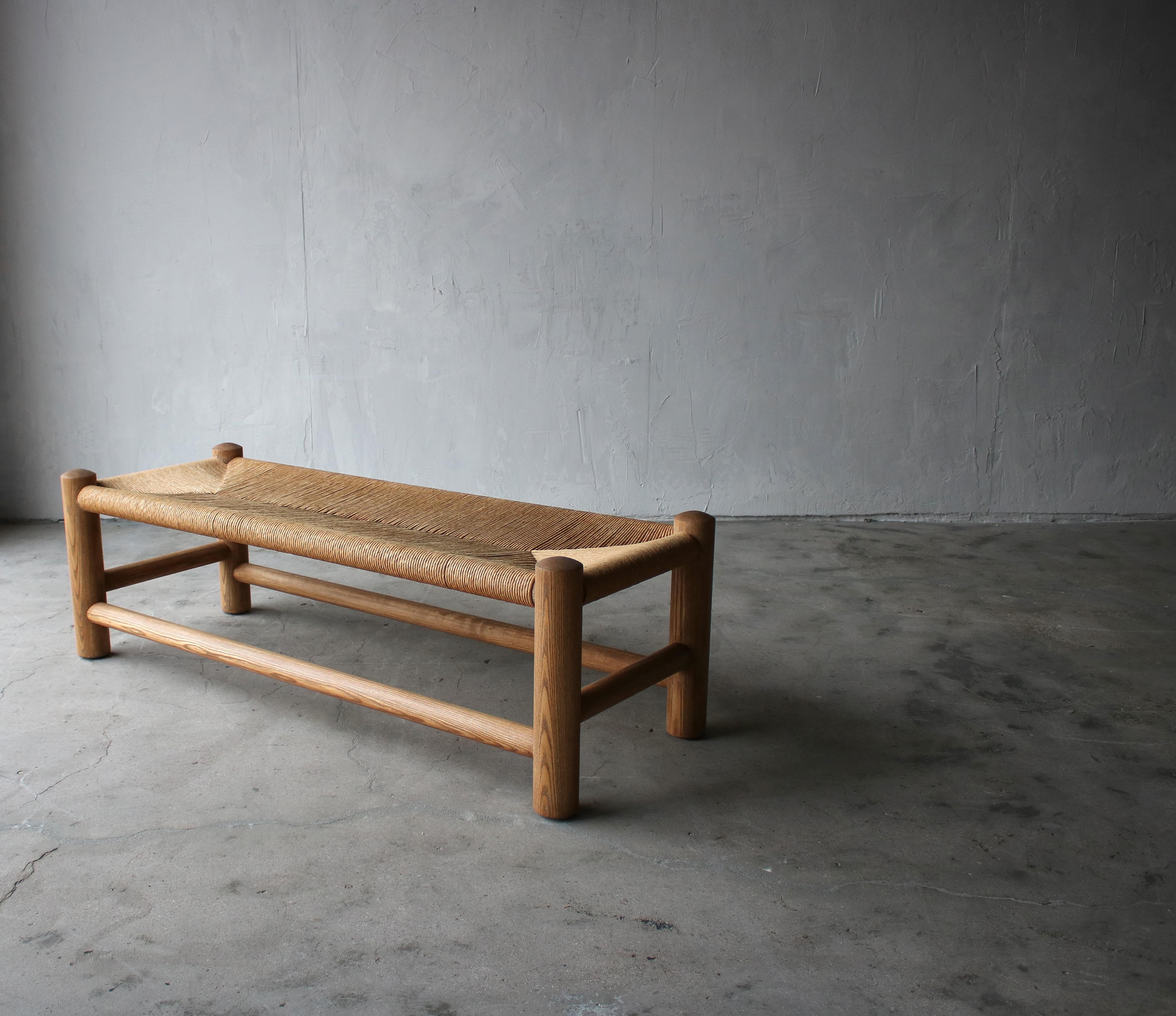 Simple and on trend as can be. This oversized midcentury bench by Wim Den Boon is a gorgeous combination of woven rush and pine. If you're looking for that neutral piece of seating that will add texture and interest to your space, look no further.