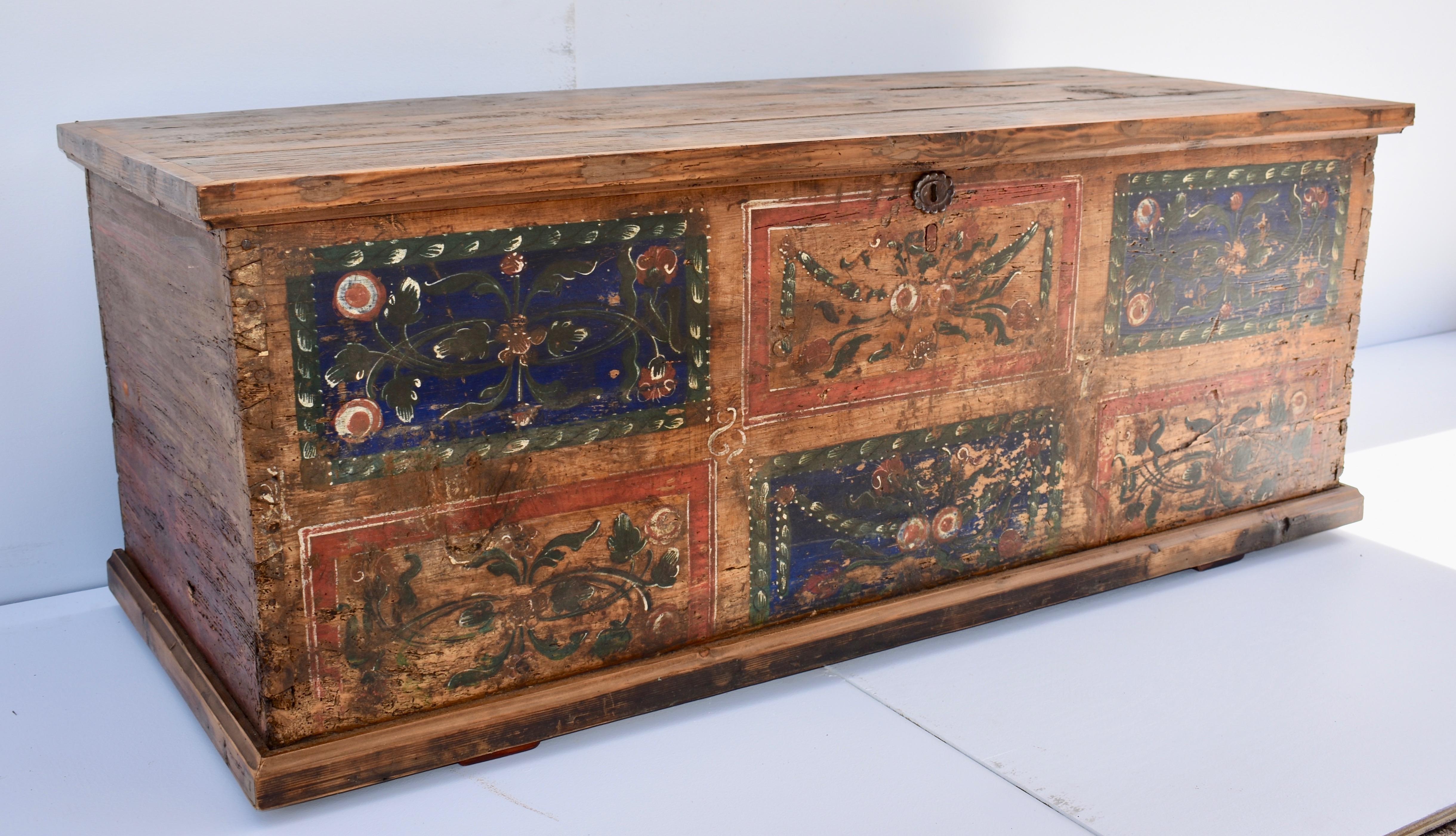 This large flat-top blanket chest in original paint would have been placed against a wall and used to store all the important linens of a modest Romanian household. The decorative front is divided into six faux panels, each painted in traditional