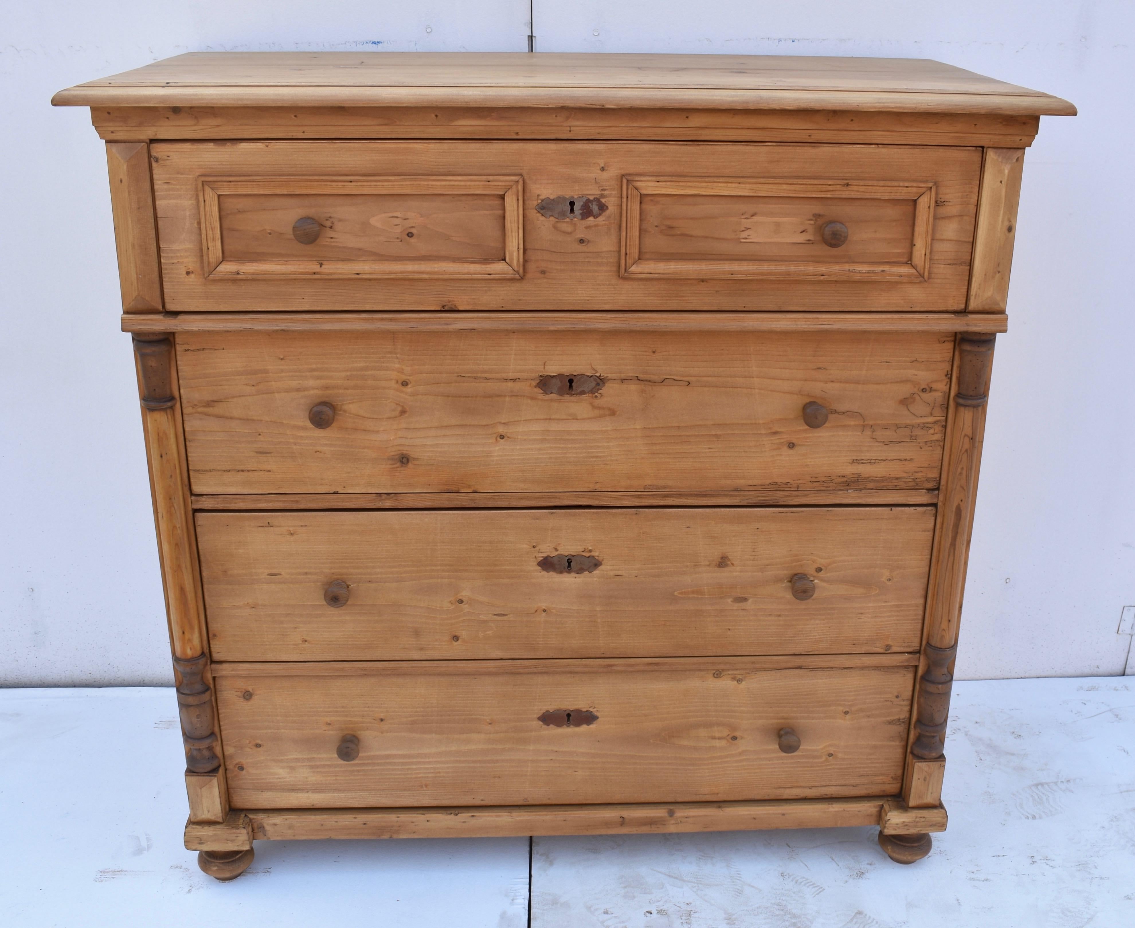What a lovely chest of drawers! The step down routed edge of the top is underlined with a fluted crown molding above four deep hand-cut dovetailed drawers, the top one with two frames of applied molding to mimic two short drawers. This one stands
