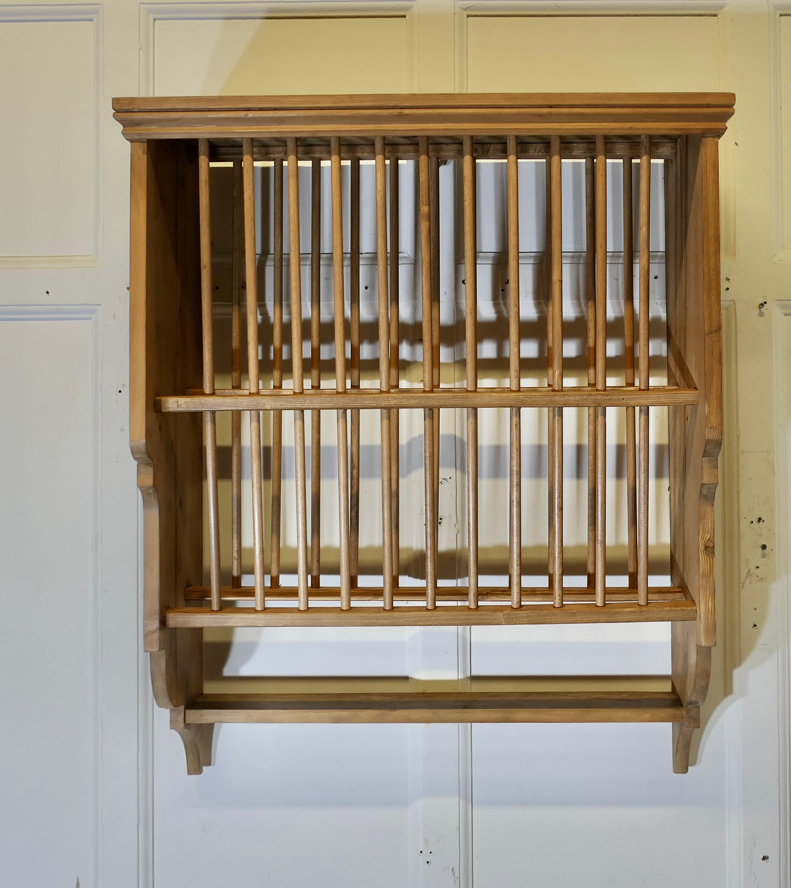 Large Pine Wall Hanging Plate Draining Rack


This useful piece hangs on the wall and drains and stores plates until required
It has a pine frame and wooden dowels with a waterfall shape, allowing 2 rows of plates to be stored at any one time, below