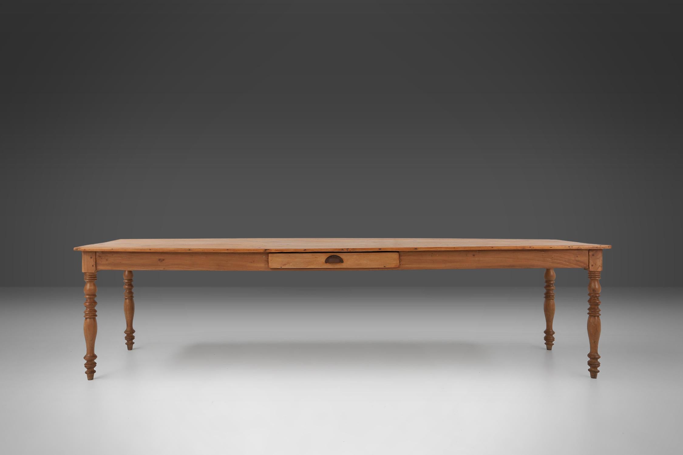 Rustic Large pine wood farm table with drawer and turned legs, France, 1850s