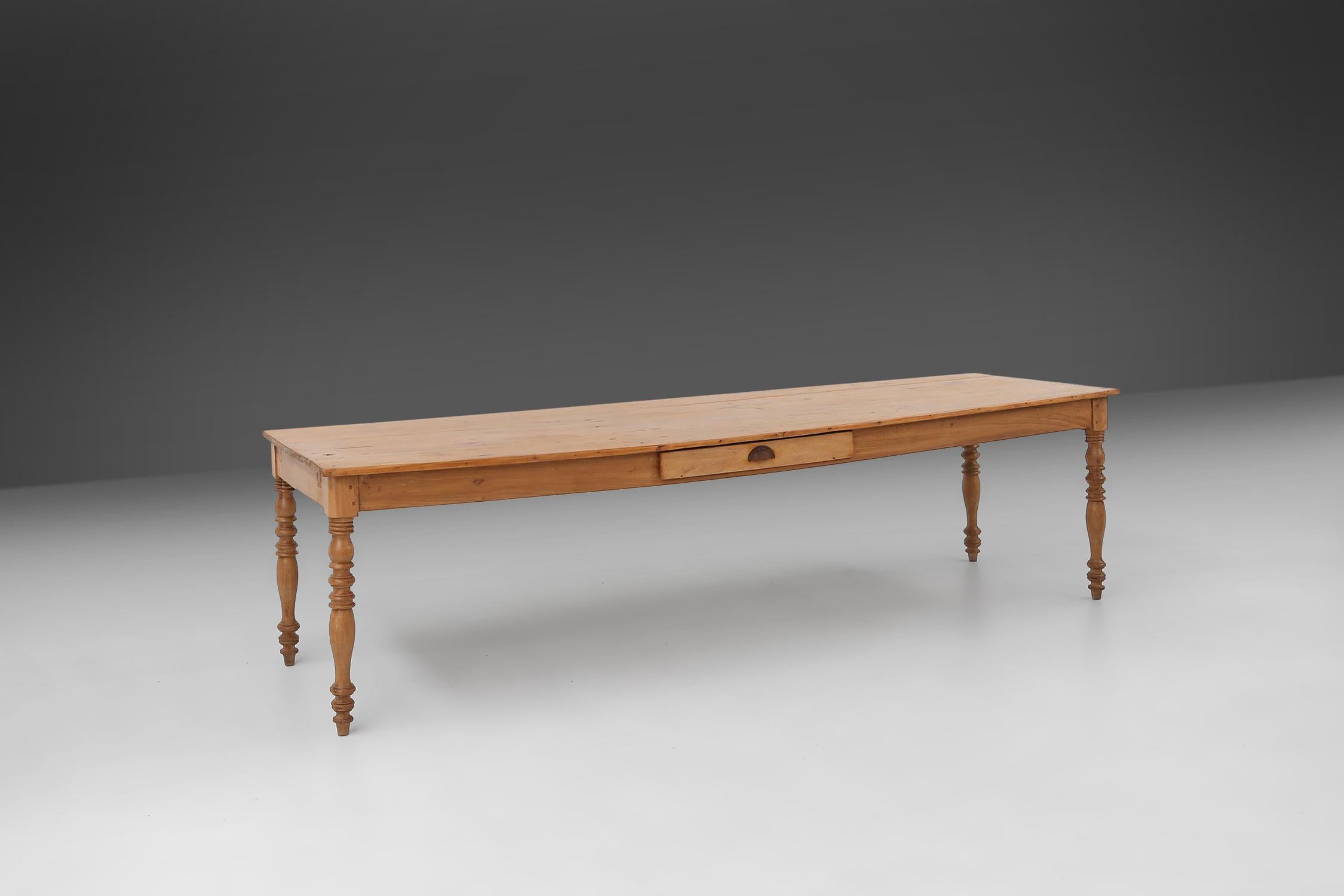 French Large pine wood farm table with drawer and turned legs, France, 1850s