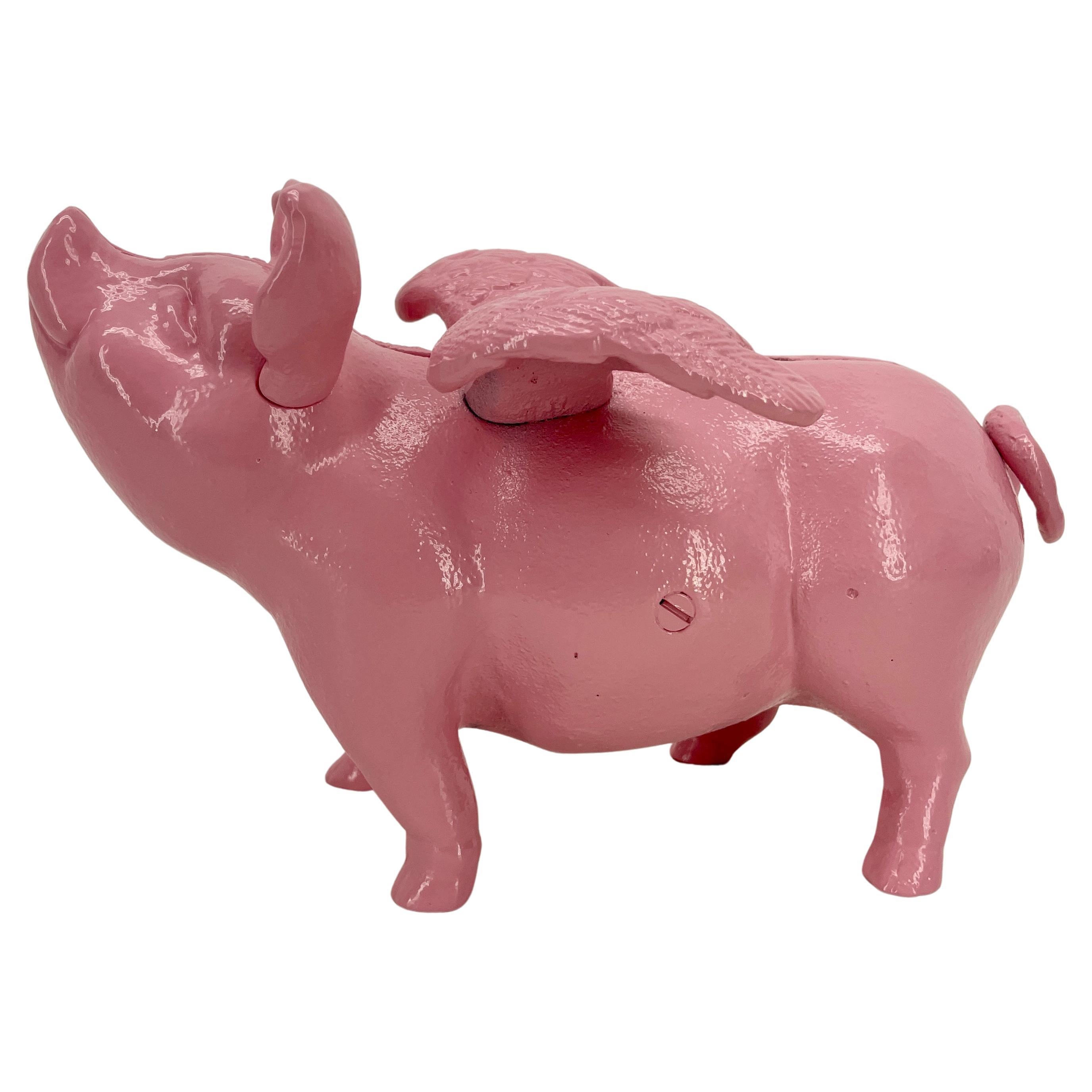 Danish piggy pink cast iron money bank or doorstopper with wings.
This smiling and charming Lady Pig is newly powder-coated in 