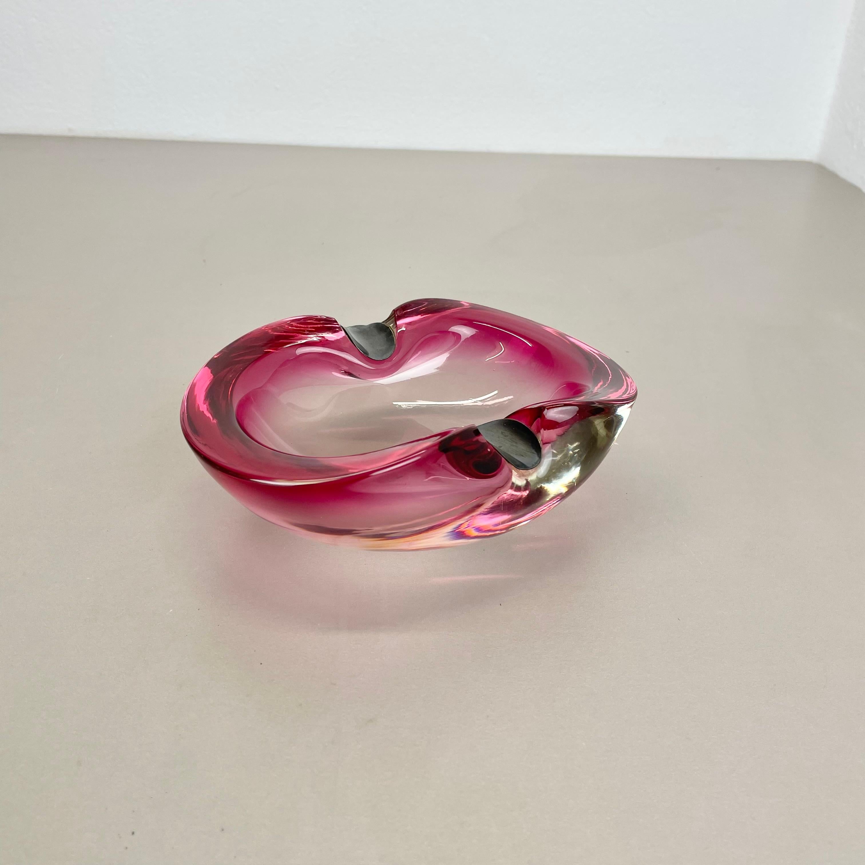 Article:

Murano glass bowl, ashtray element with sterling silver layers


Origin:

Murano, Italy


Decade:

1970s


This original glass shell bowl was produced in the 1970s in Murano, Italy. An elegant purple pink Murano glass element with two