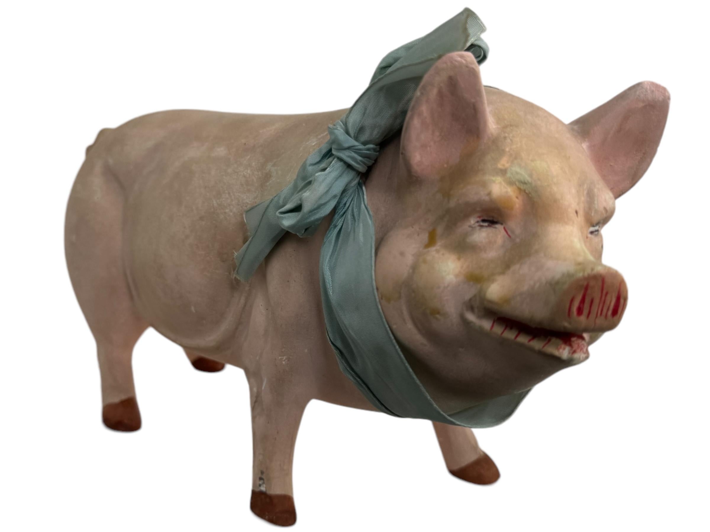 A beautiful pink pig candy container. This nice handmade Candy Container features composition and paper mache body, cardboard head to neck. The head comes off, opening inside compartment. Made of a composition material, hand painted and original