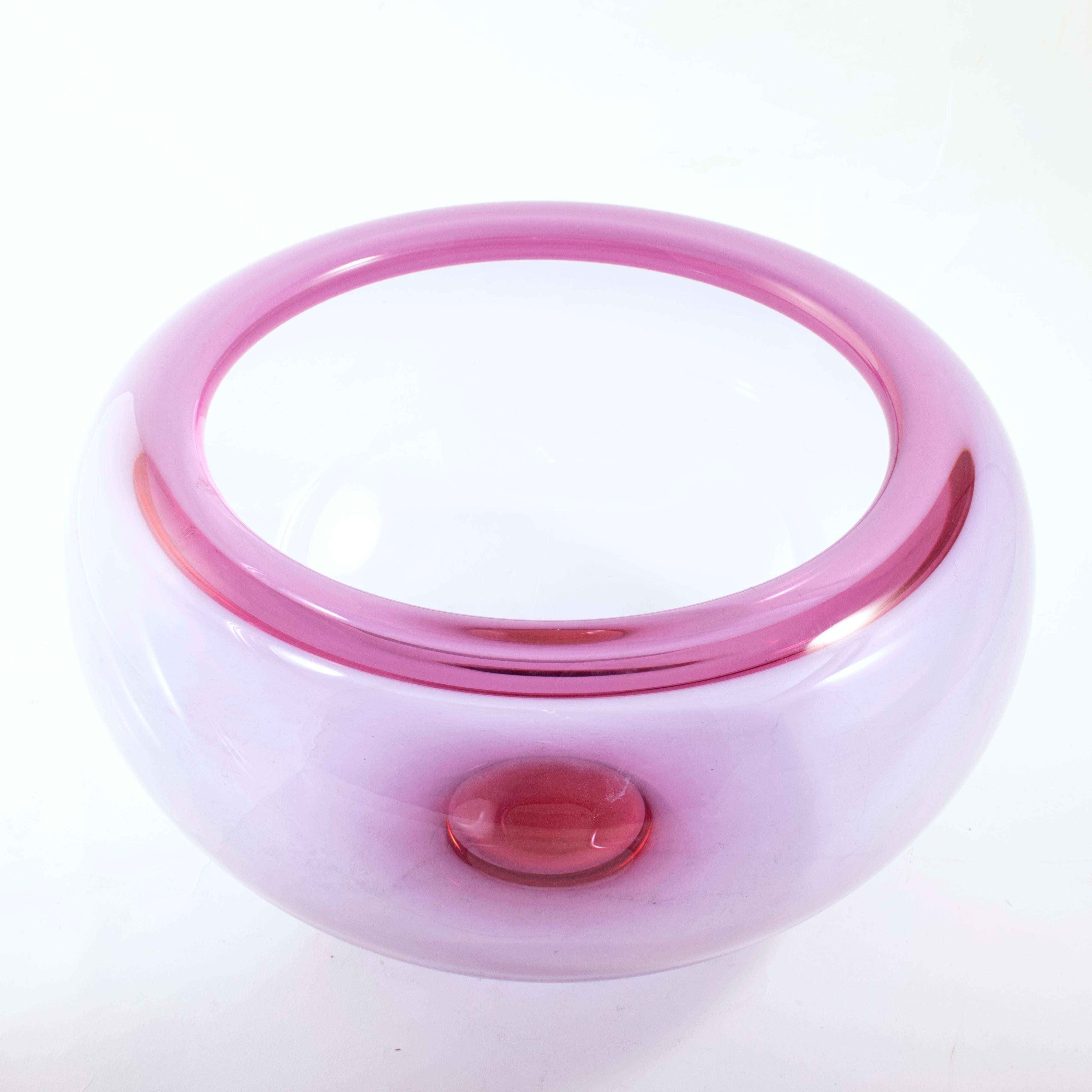 A pink glass bowl designed by Per Lütken for Holmegaard, Denmark, circa 1960s.
Per Lütken (1916-1998) was a Danish glassmaker, most famous for his works at Holmegaard Glass Factory. He worked at the Holmegaard Glass Factory from 1942 until his