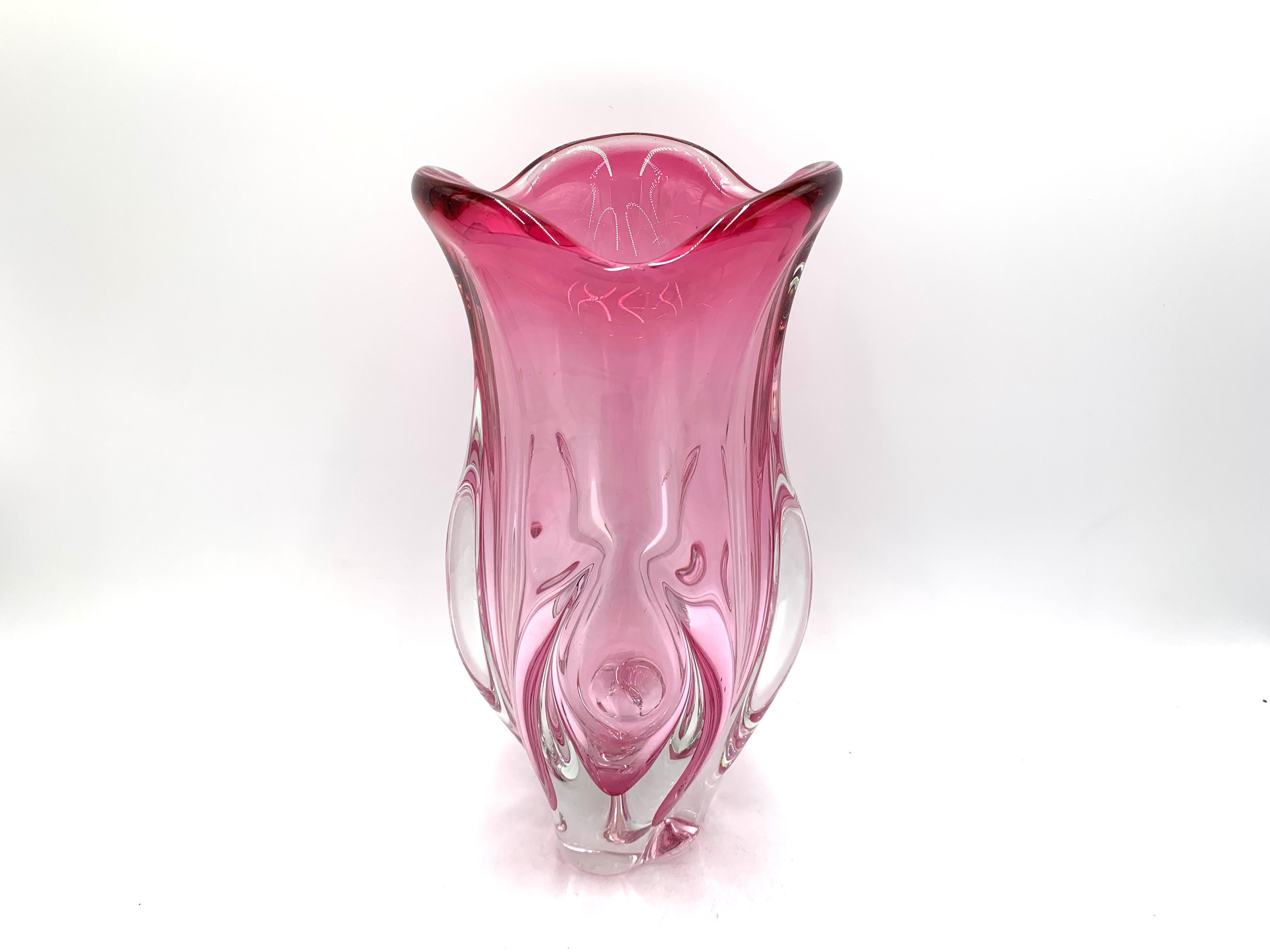 A large heavy vase made of art glass in a pink color.

Produced by Chribska Sklarna in Czechoslovakia in the 1960s.

Very good condition.

Measures: Height 32.5 cm. Diameter 16 cm.
