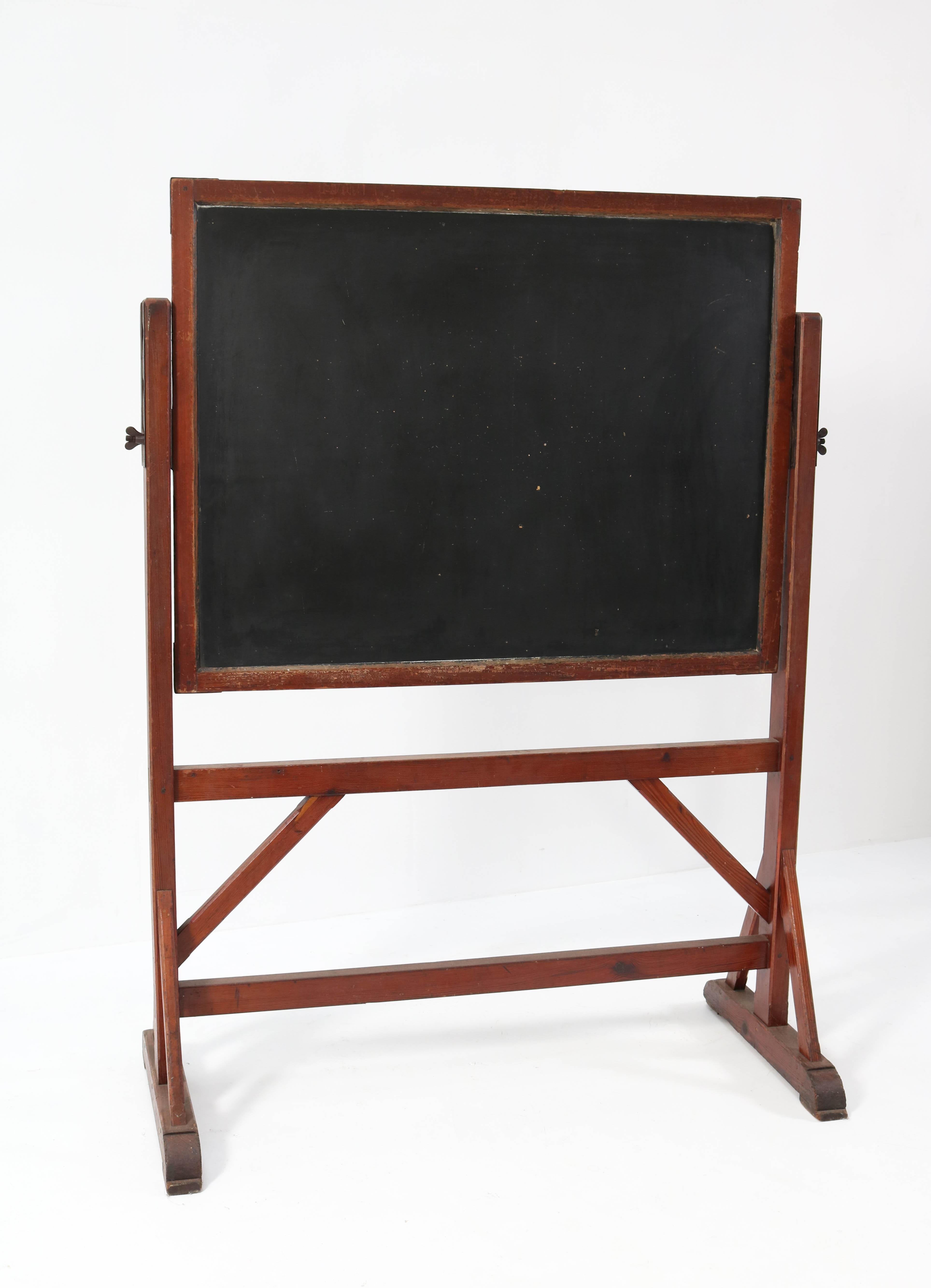 Magnificent and rare Art Nouveau blackboard chalkboard.
Striking Dutch design from the 1900s.
Solid pitch pine frame with double sided blackboard chalkboard.
This decorative piece of furniture would make the perfect menu board, idea board or