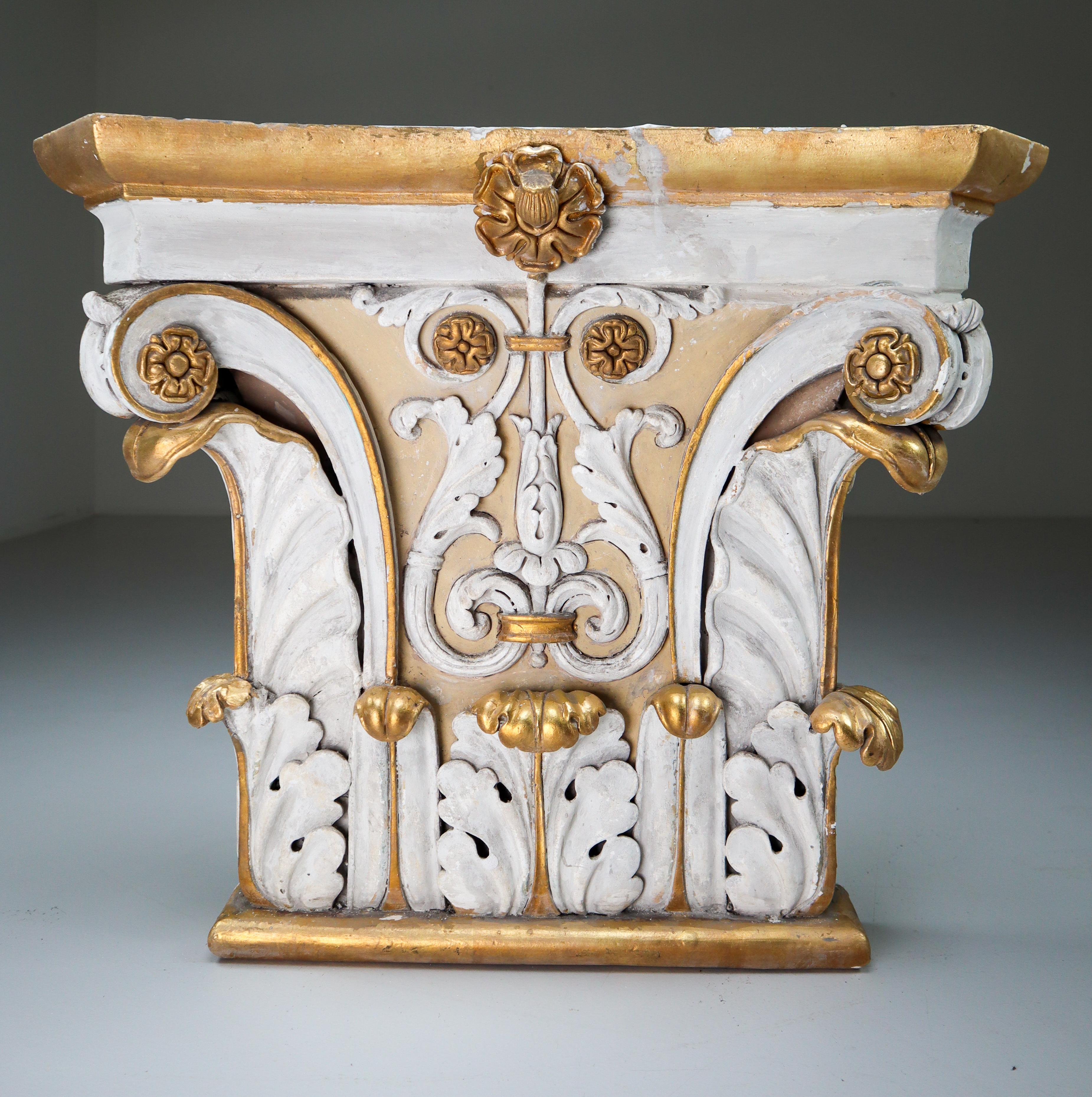 Decorative large cast plaster capital of Iconic order, Austria, 1870-1880. The capital is formed by two volutes on the flanks connected with decorative moulding polychrome gold painted. Originally, these were placed in Austrias public
