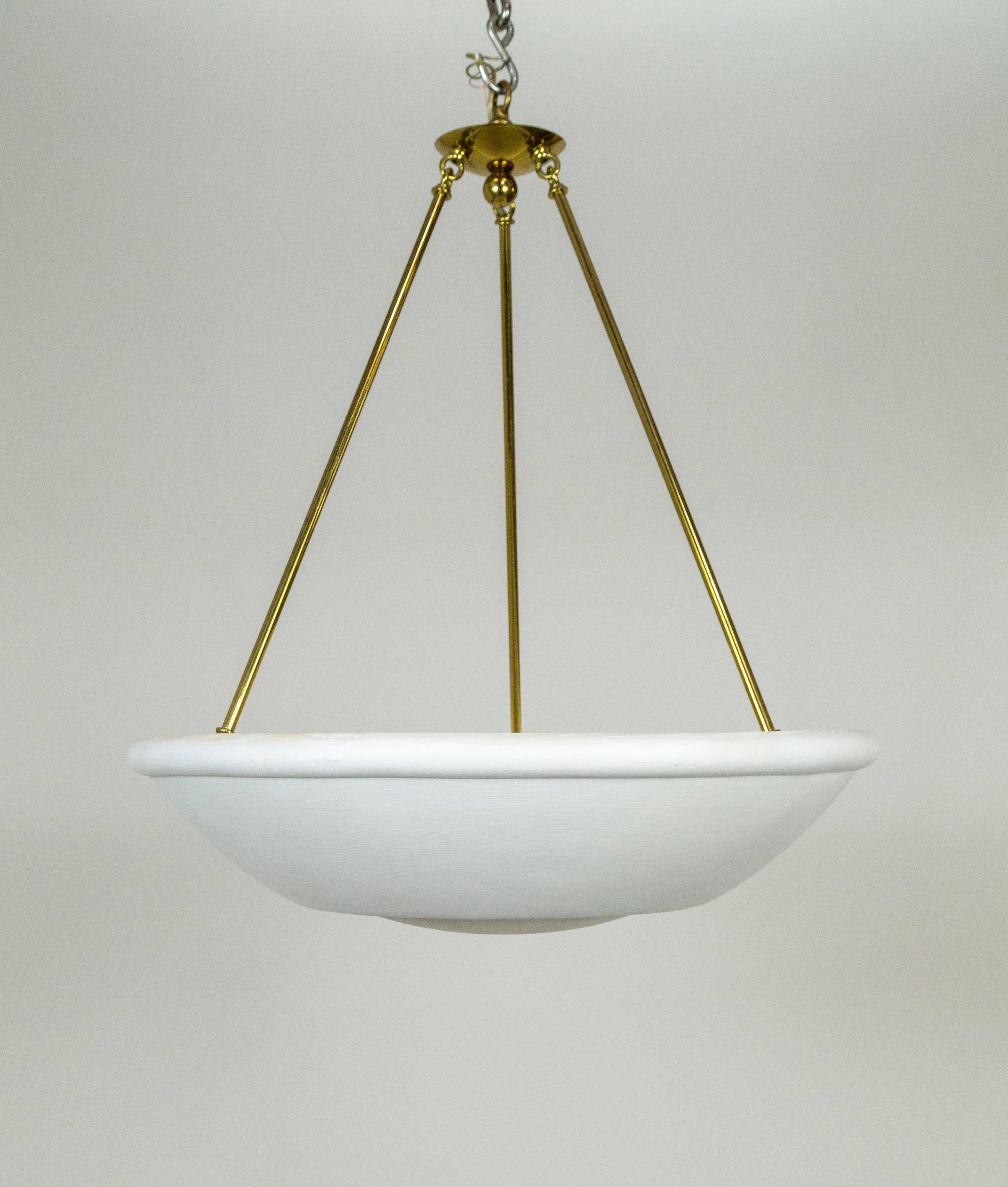 A large, plaster bowl uplight pendant, held by three brass stems coming together in a simple canopy. Designed by Randall Whitehead and made by Phoenix Day of San Francisco in the late 1980s. With a circular ridge on the bottom for added detail and
