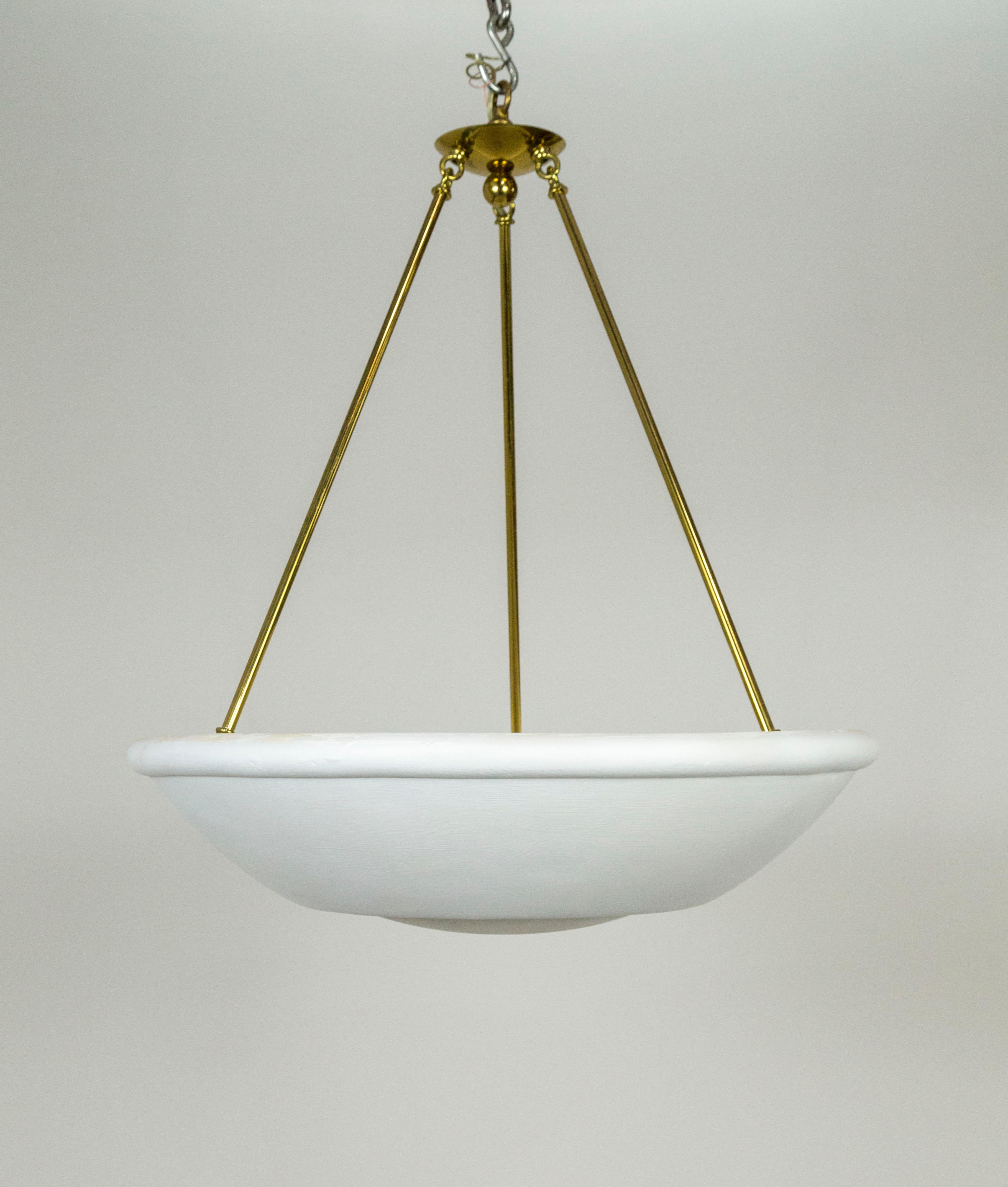 A large, plaster bowl uplight pendant, held by three brass stems coming together in a simple canopy. Designed by Randall Whitehead and made by Phoenix Day of San Francisco in the late 1980s. With a circular ridge on the bottom for added detail and