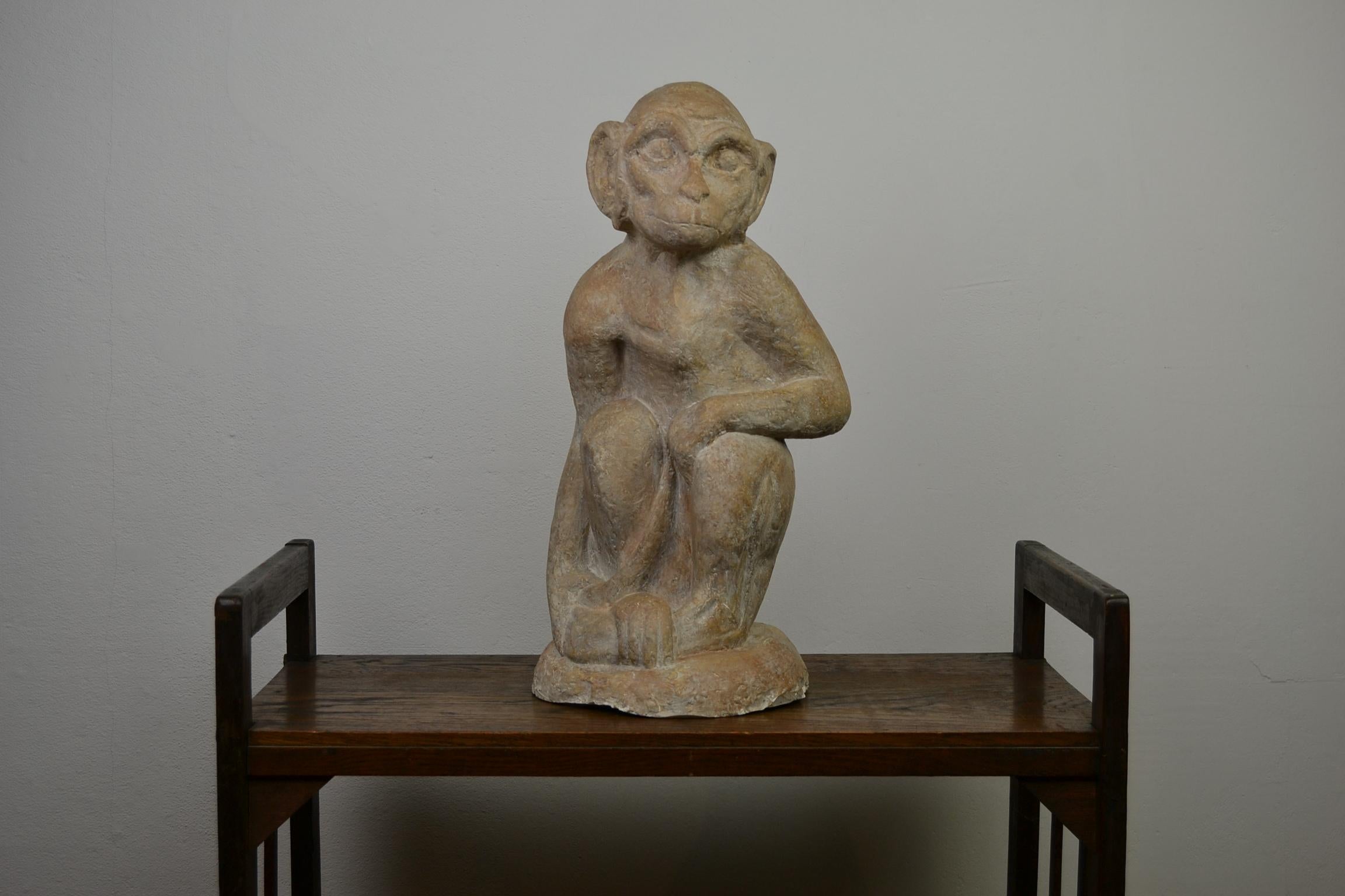 Stylish large plaster monkey sculpture.
This handmade animal sculpture of a sitting ape is not made from terracotta, but from gypsum or plaster. It's a life-size detailed monkey sculpture which will look great in your interior. Fits great in Organic
