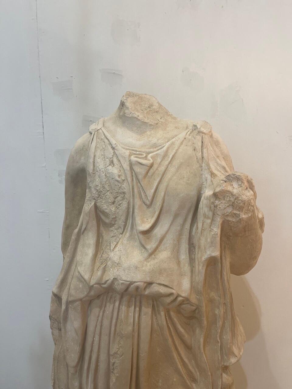 Large Plaster Sculpture of Greek Goddess, headless and armless. Nicely aged patina.